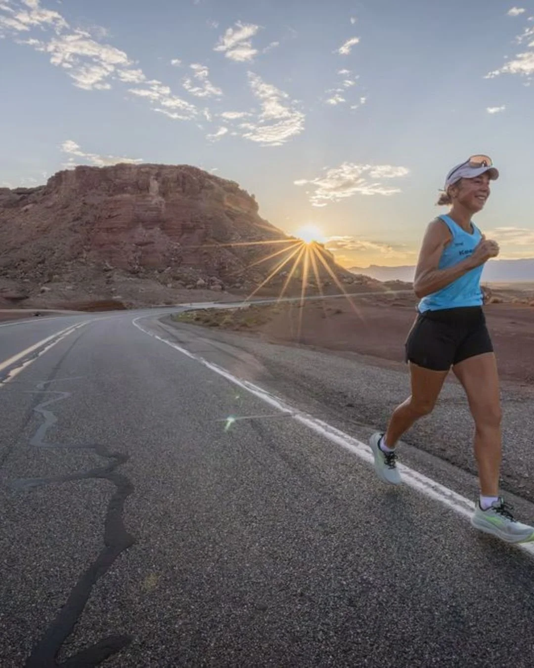 Mina Guli IG running with sun behind her.jpg