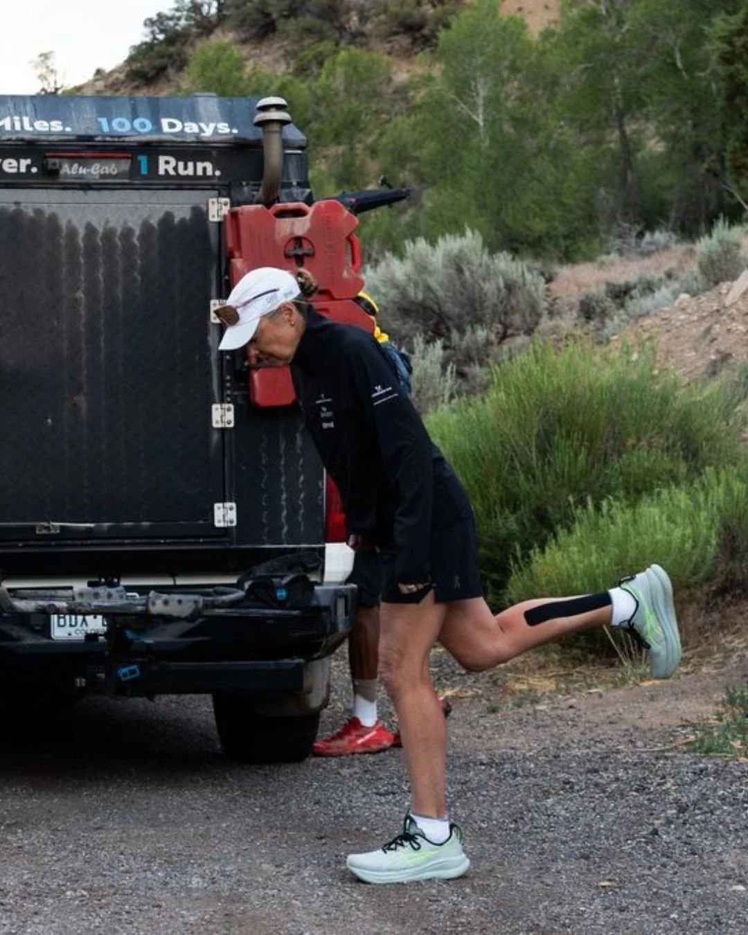 Mina Guli IG stretching at the truck.jpg