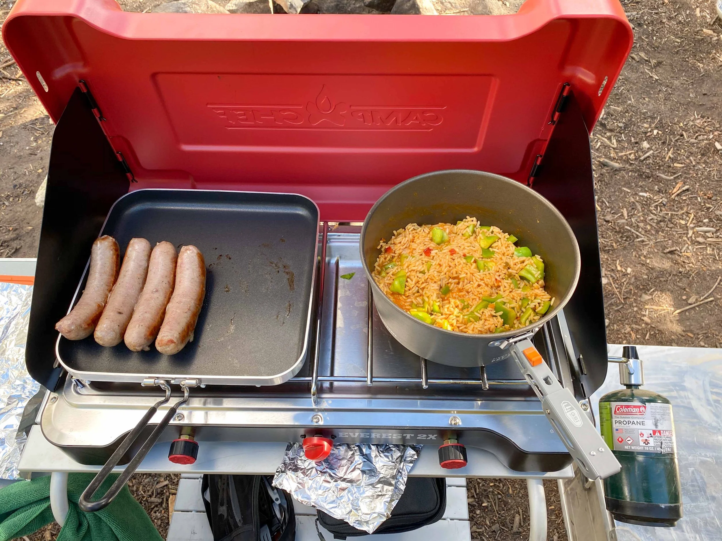 Making sausages and rice on the camp stove with Titus Adventure Company, camping & 4WD rentals in Denver, CO