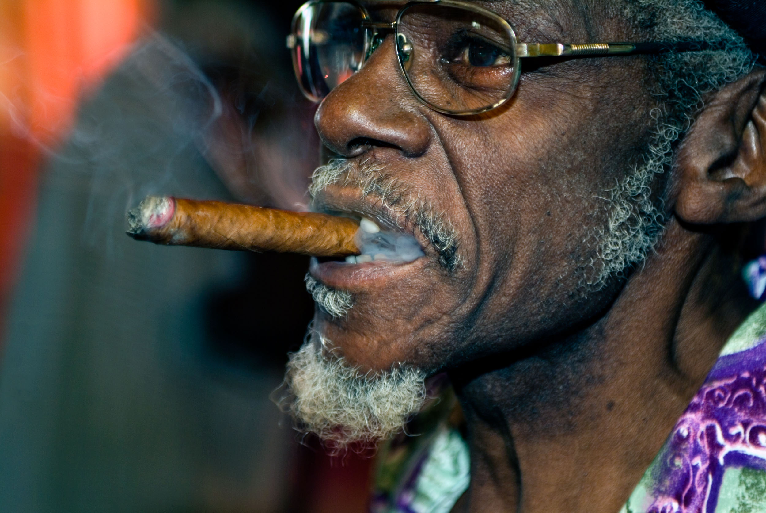 Smoking Cuban Peso Cigar