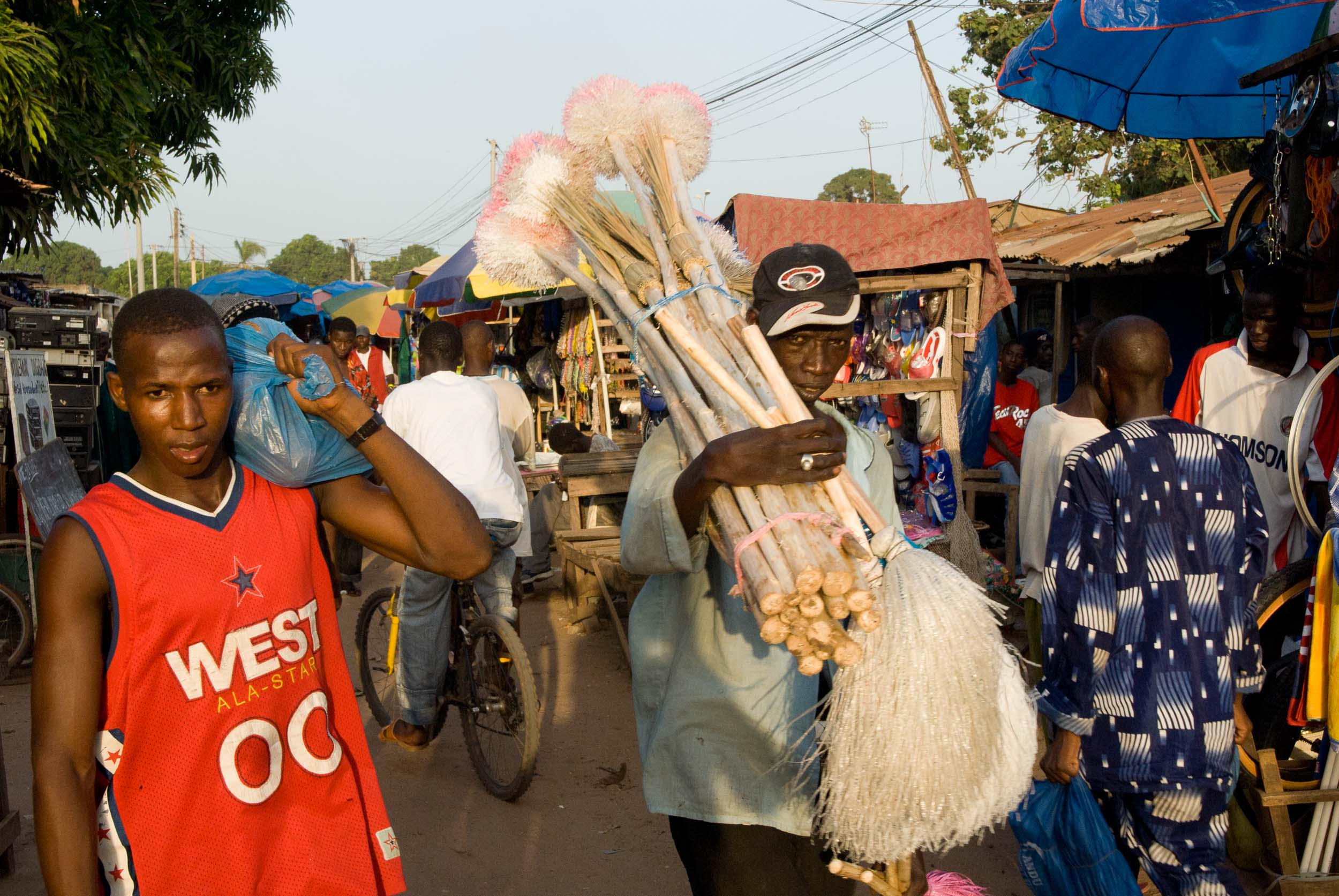  Carrying Brooms, Open Air Market, Gambia, Africa 