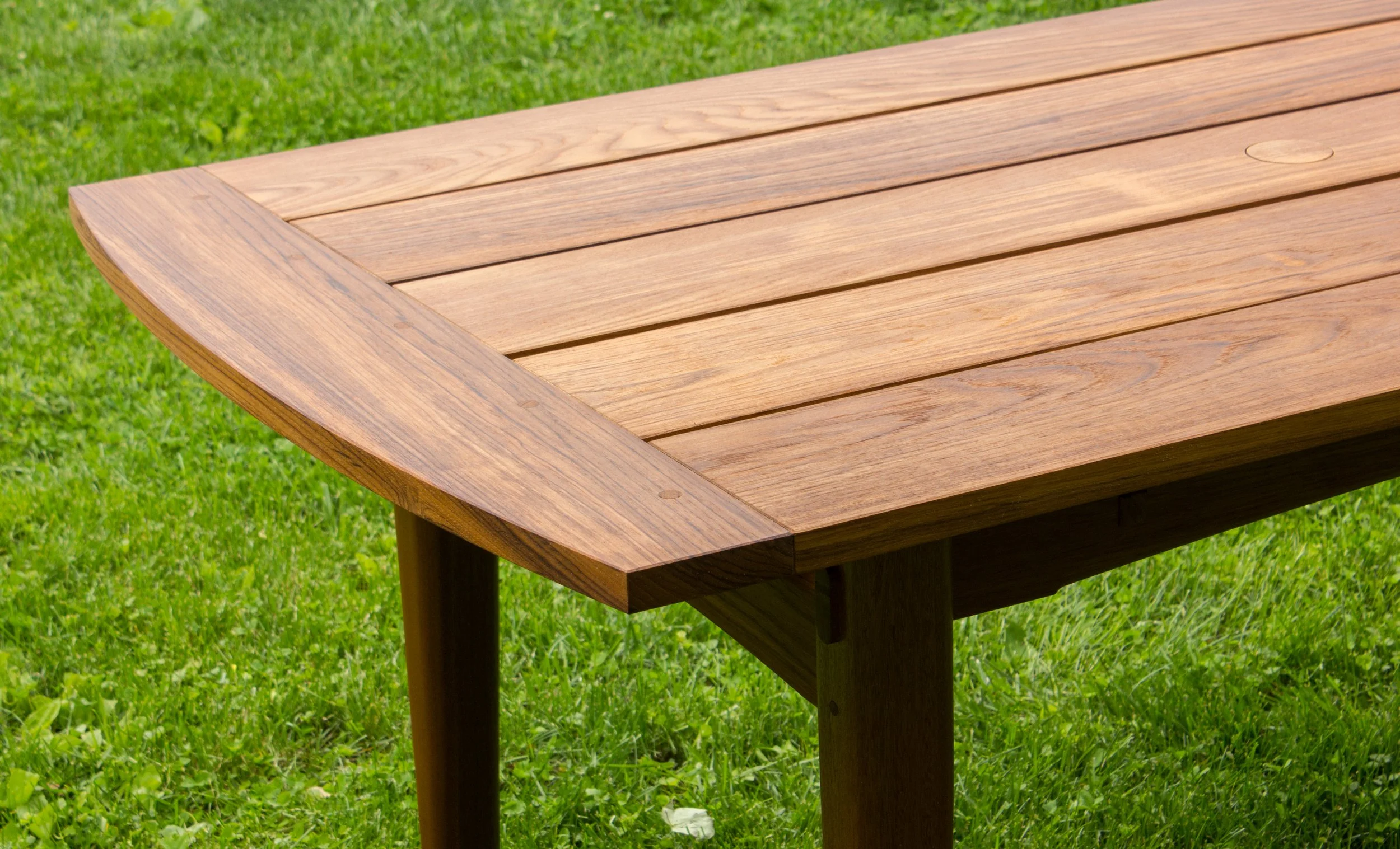 A Teak outdoor dining table handcrafted to seat 6 and last a lifetime. built by Feeney Furniture