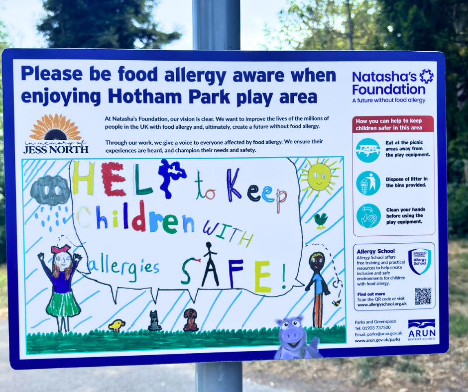 a playground sign asking children and parents to be allergy safe and allergy aware when playing and sharing equipment
