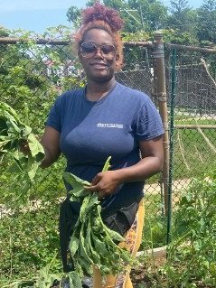 photo: woman displaying greens