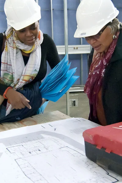   Two Calvert Impact Capital staff members visit     Israel Manor     Inc. Life Center, a Calvert Impact Capital portfolio partner, in Northeast Washington DC, as construction is underway. Now open, Unity Healthcare provides health services and community spaces, and is co-located with Israel Manor Baptist Church.     