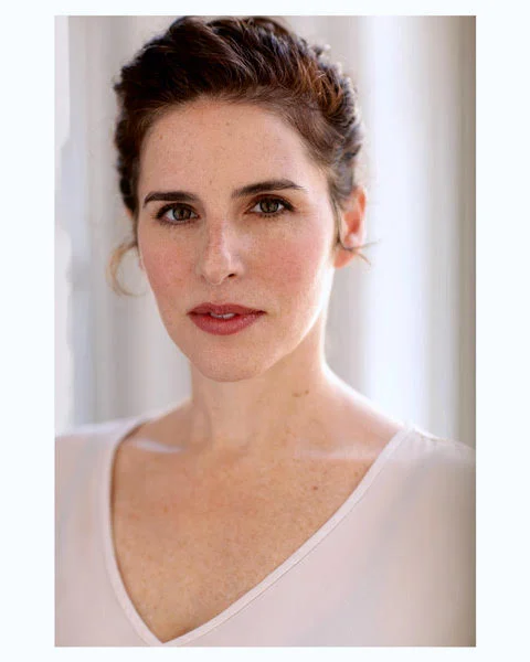 Headshot of Kyra Miller, actor, singer, and Alexander Technique teacher. Kyra is a young woman in her 30s.