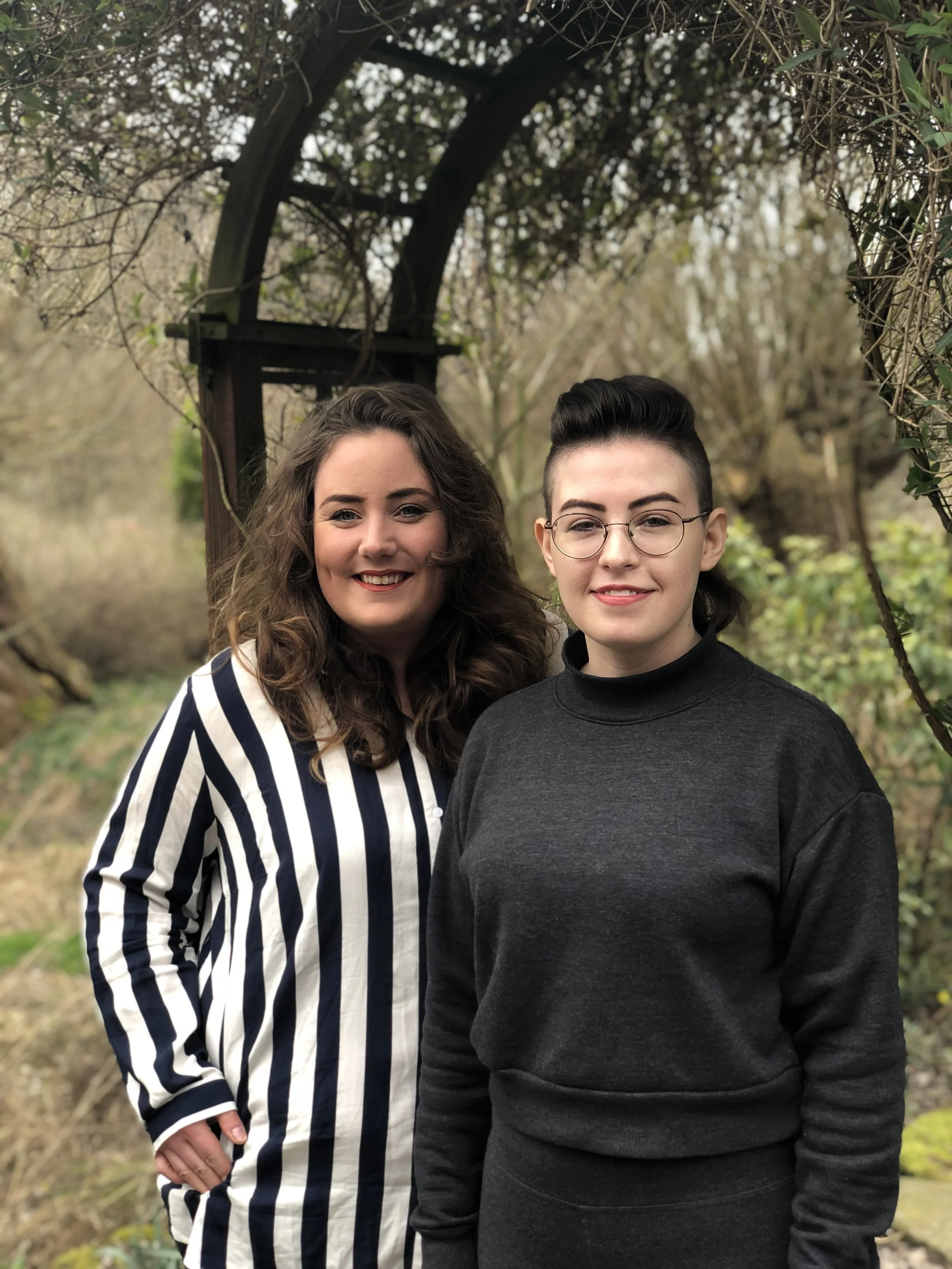 Marina (left) and Kelsey (right) chat in the garden entrance about working together and share their creative ideas for the upcoming year.