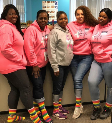 Ladies rocking their Sock Out Cancer socks