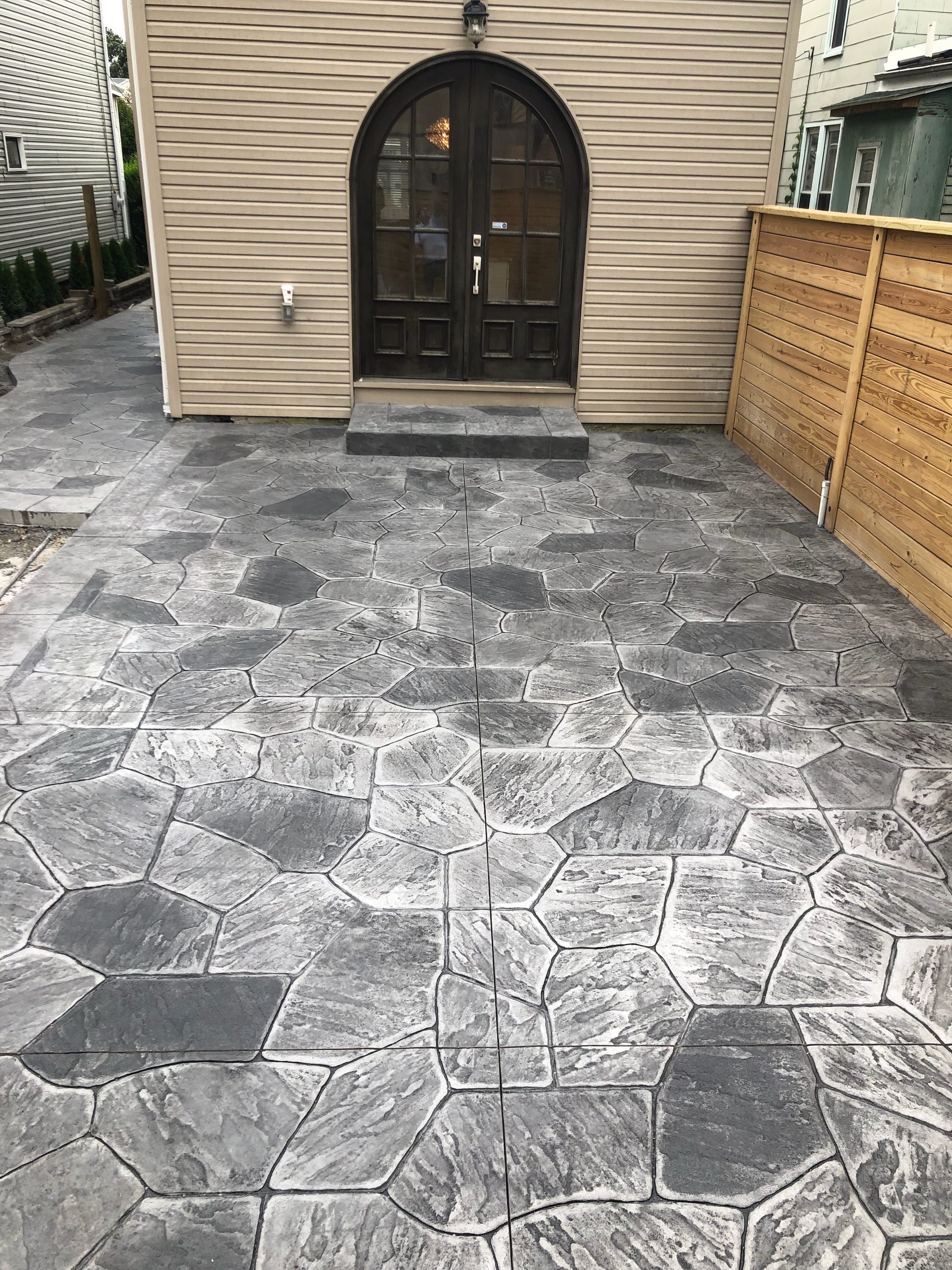 Stamped Concrete Rear Patio with Landin and Steps, Large Seating Area, Side Walkway