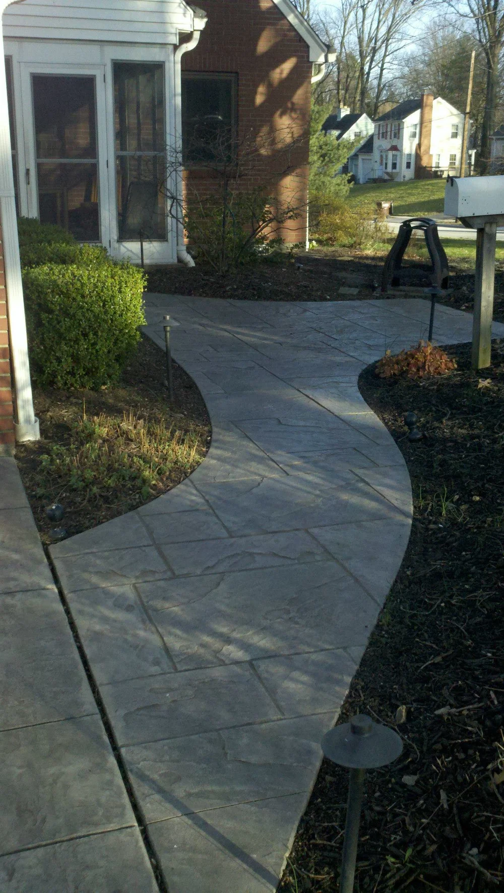 stamped concrete patio with fire pit on Our Work Scott Concrete