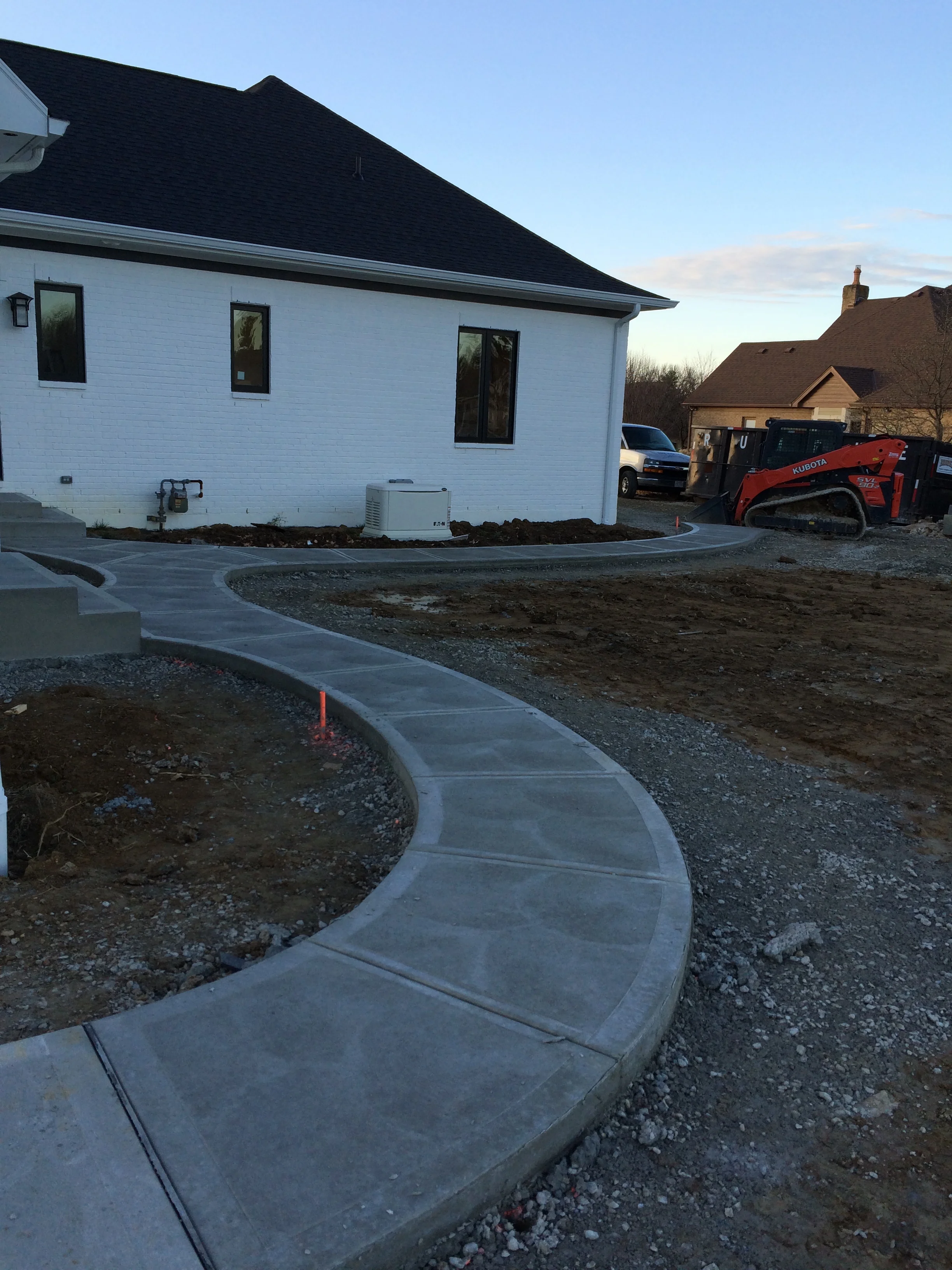 Traditional Concrete Rear Walkway System with Steps and Landings Swirl Finish
