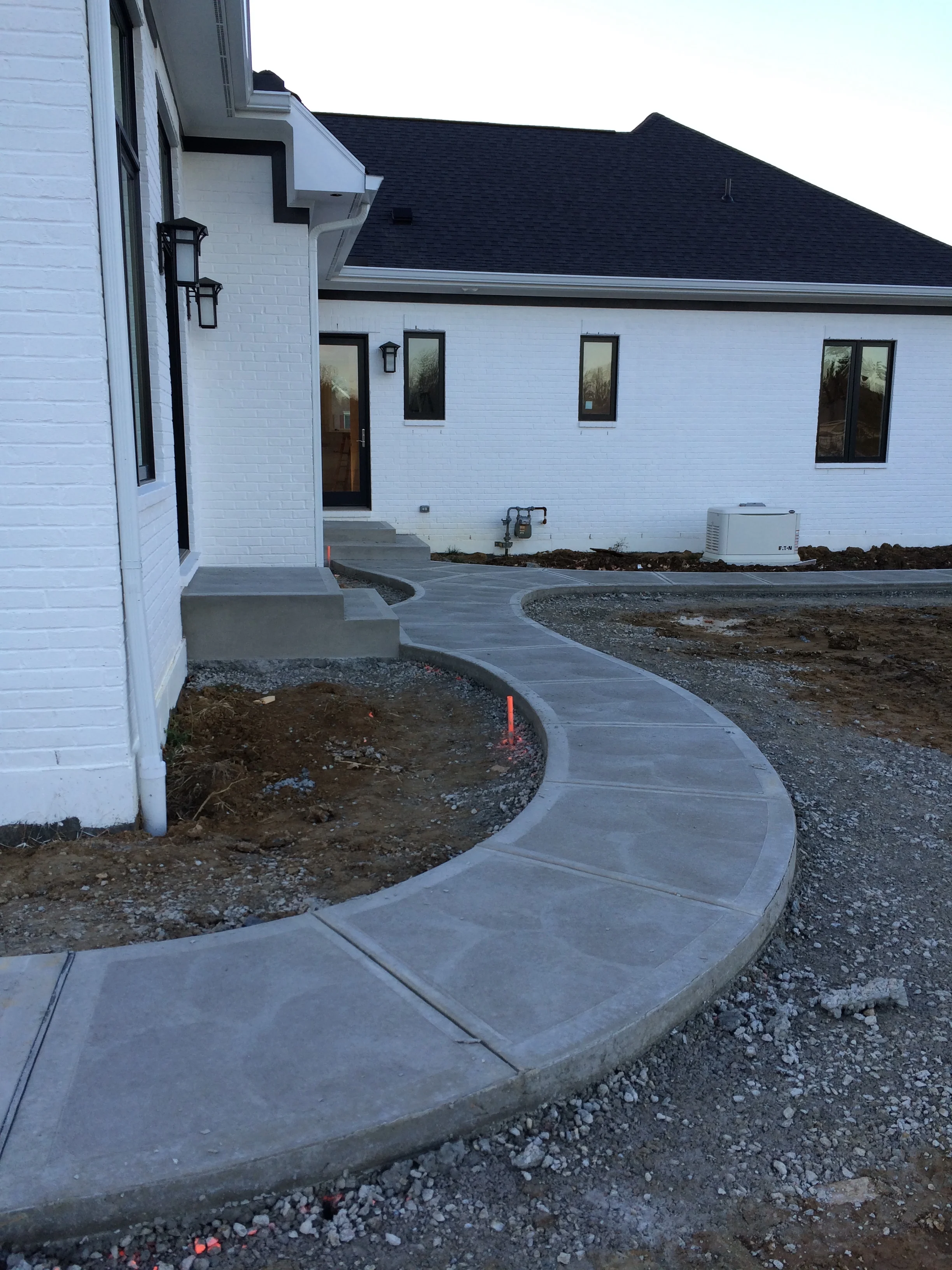 Traditional Concrete Rear Walkway System with Steps and Landings Swirl Finish