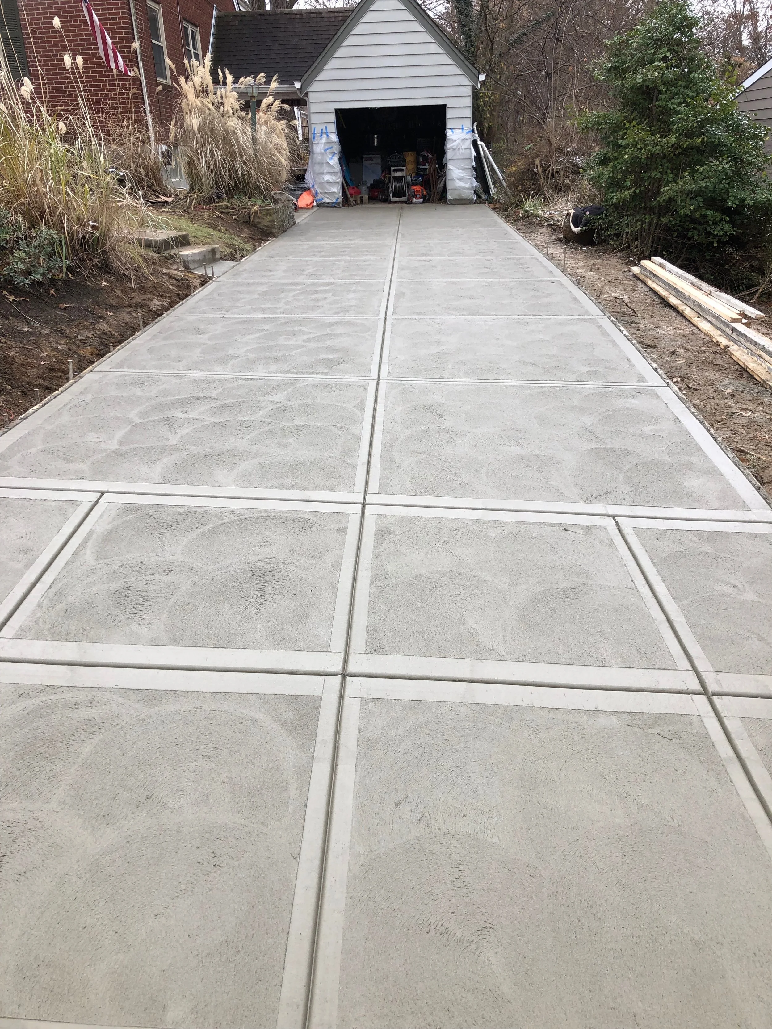 Traditional Concrete Driveway, Public Sidewalk, and Apron with Swirled Finish