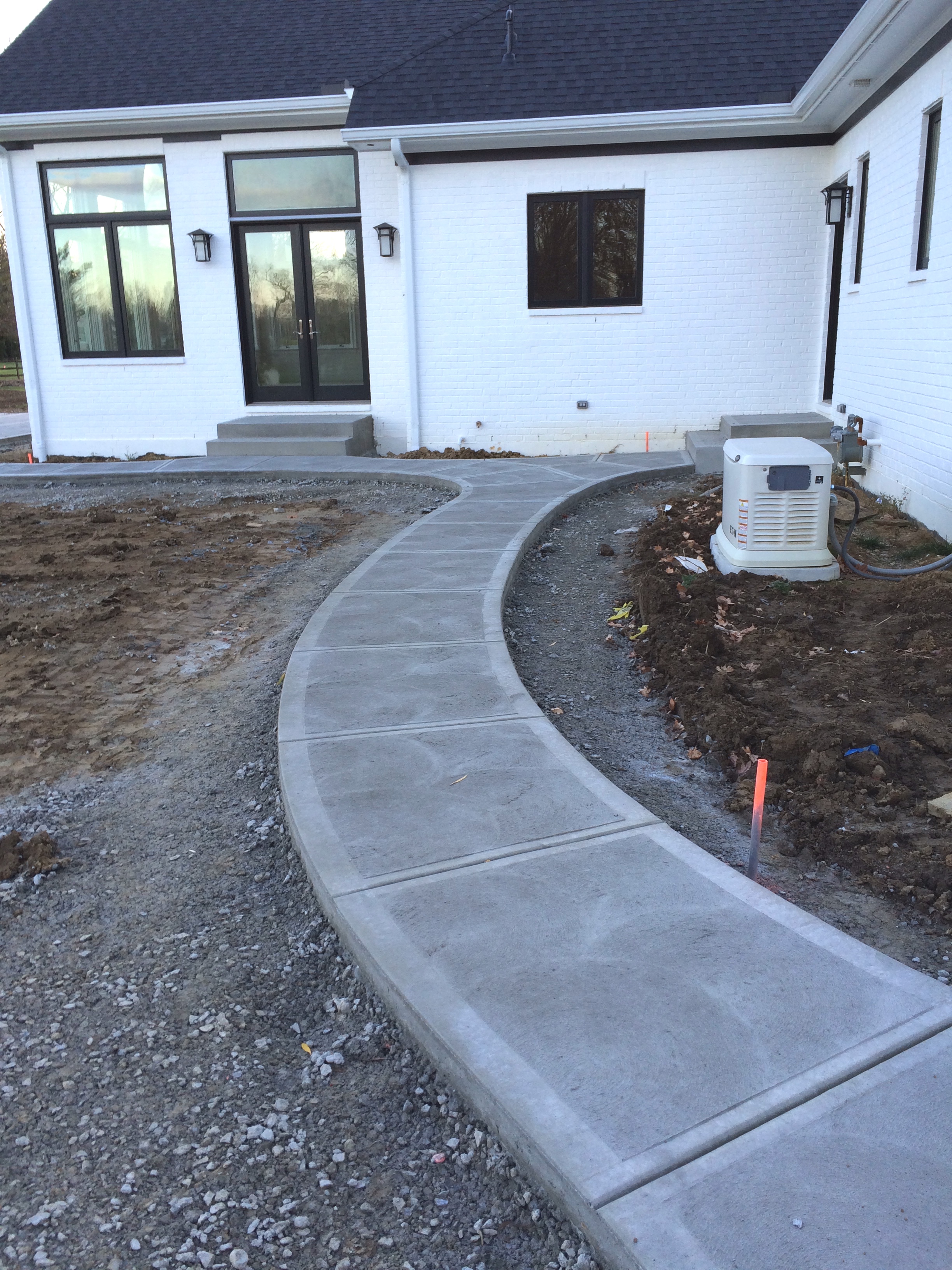 Traditional Concrete Rear Walkway System with Steps and Landings Swirl Finish