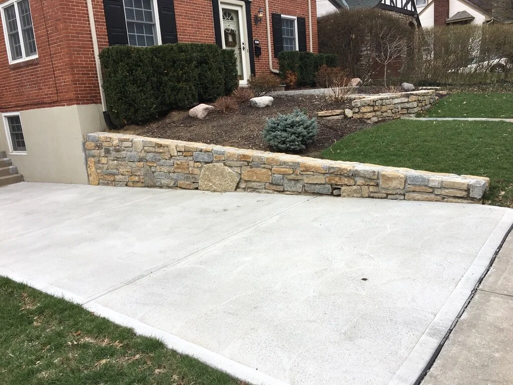 Traditional Concrete Driveway with Natural Stone Retaining Wall, Steps, Front Walkway and Landing