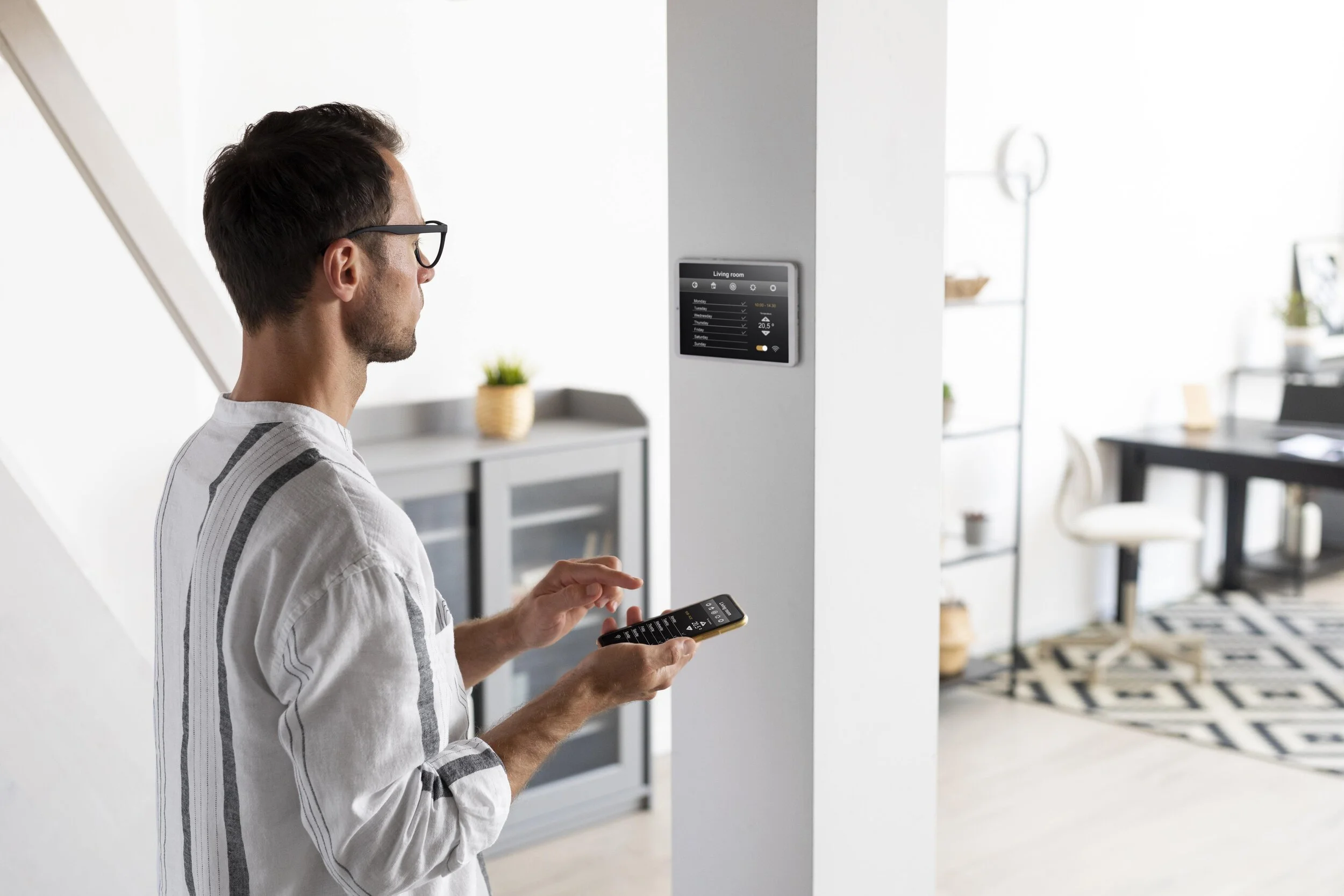 person-using-smartphone-his-automated-home-min.jpg