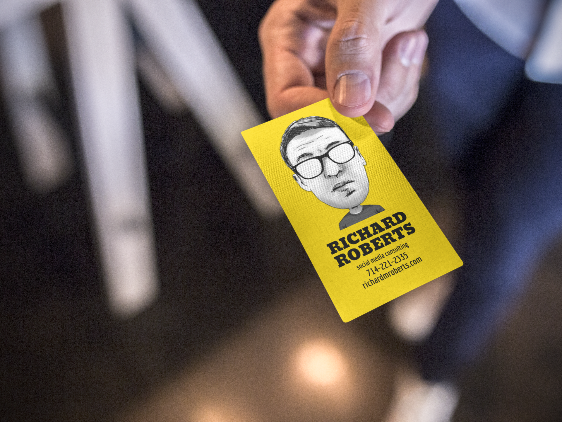 vertical-business-card-mockup-being-held-by-a-man-a15031.png