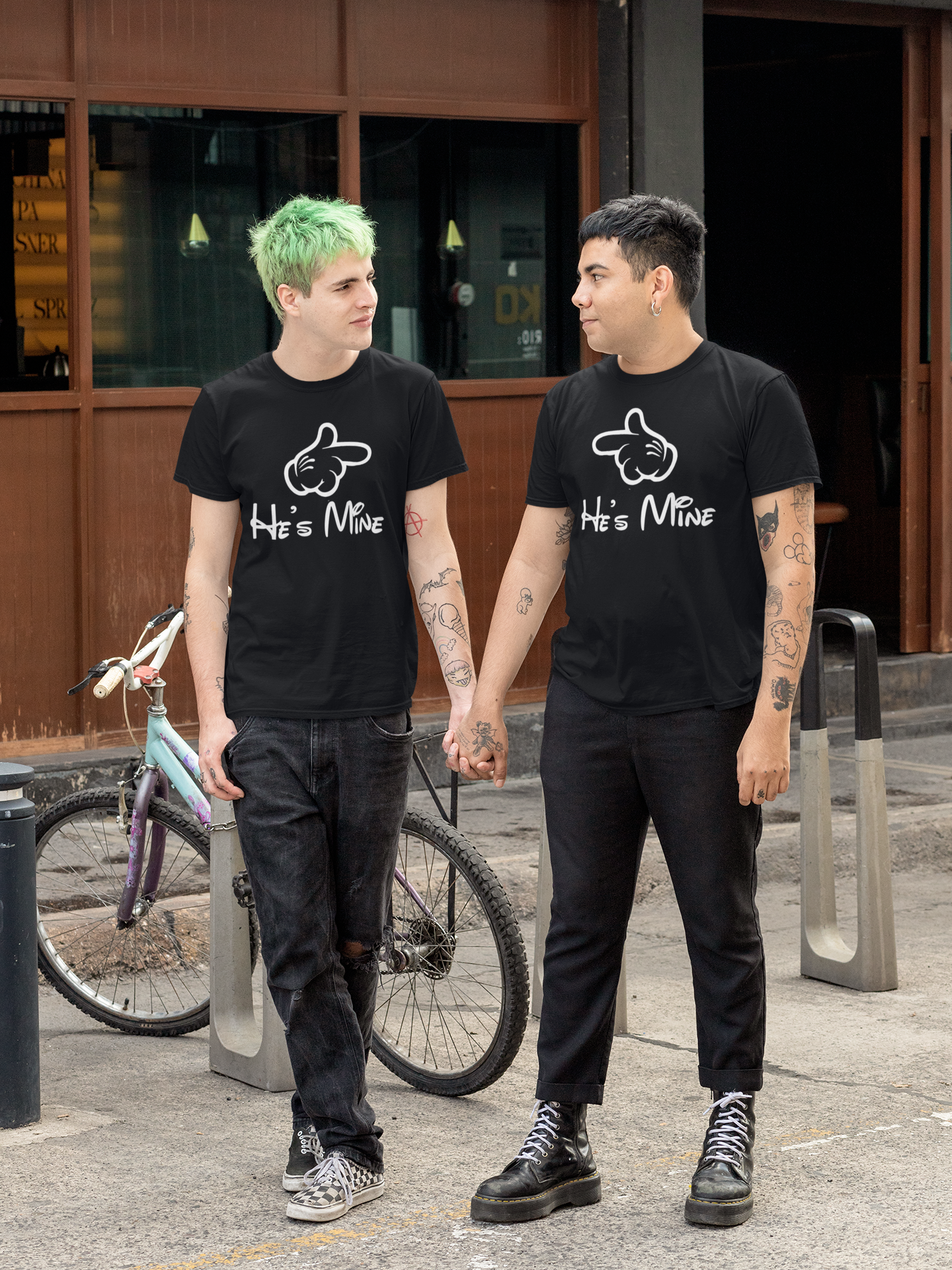 t-shirt-mockup-of-an-lgbt-couple-holding-hands-by-a-street-30440.png