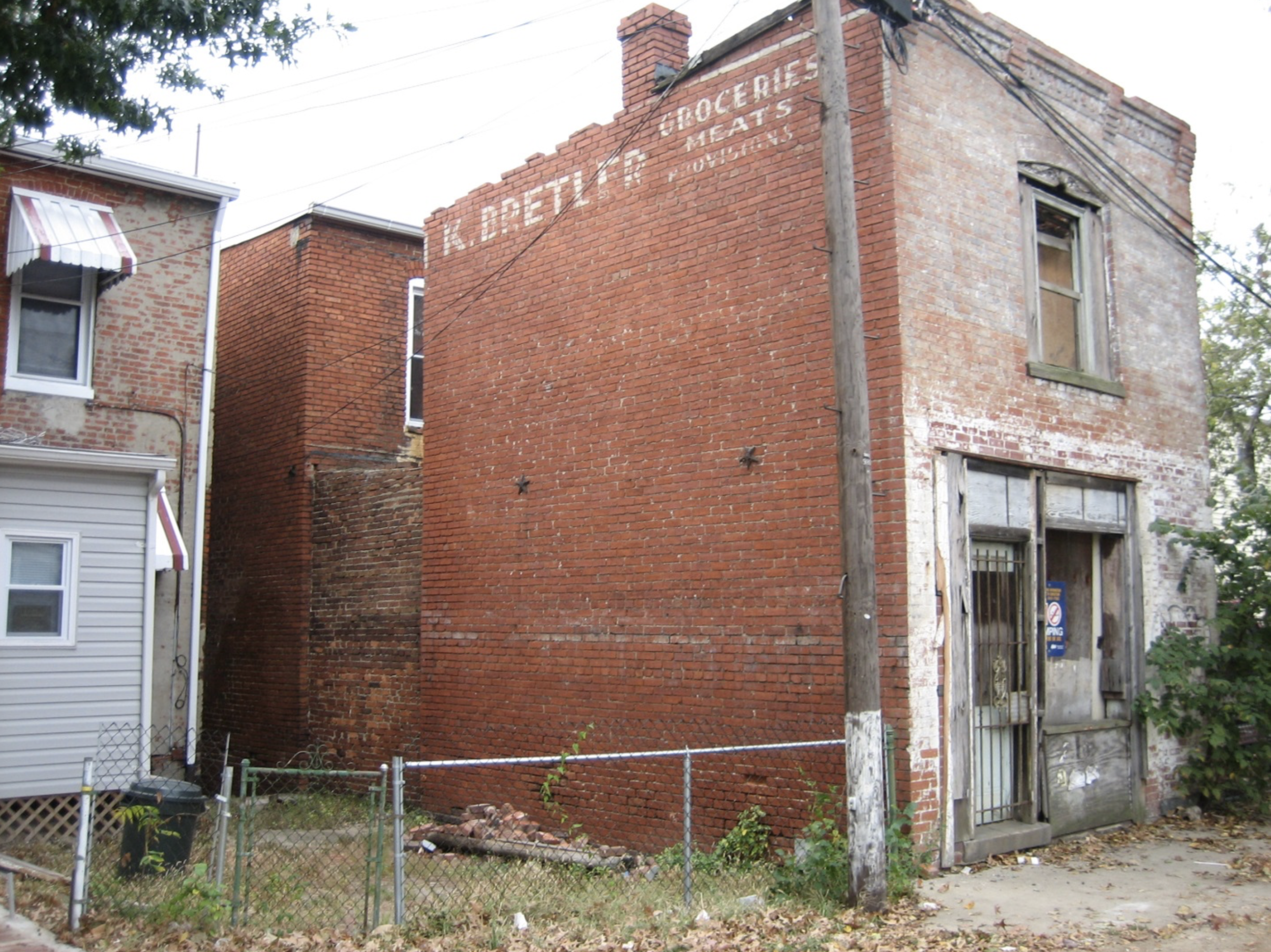 Butcher Shop Grocery Store on Capital Hill Renovation Brick Building Before Photo