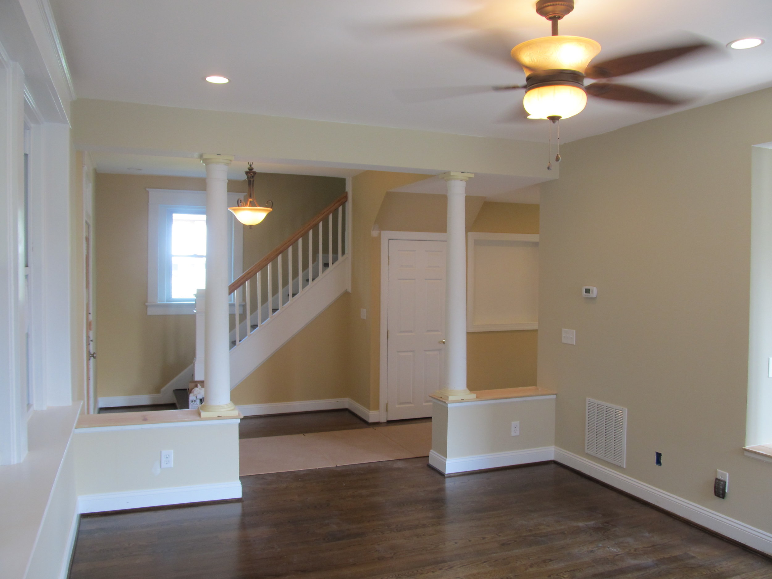 Blue Wall Yellow Door Home Stairway After Renovation Photo