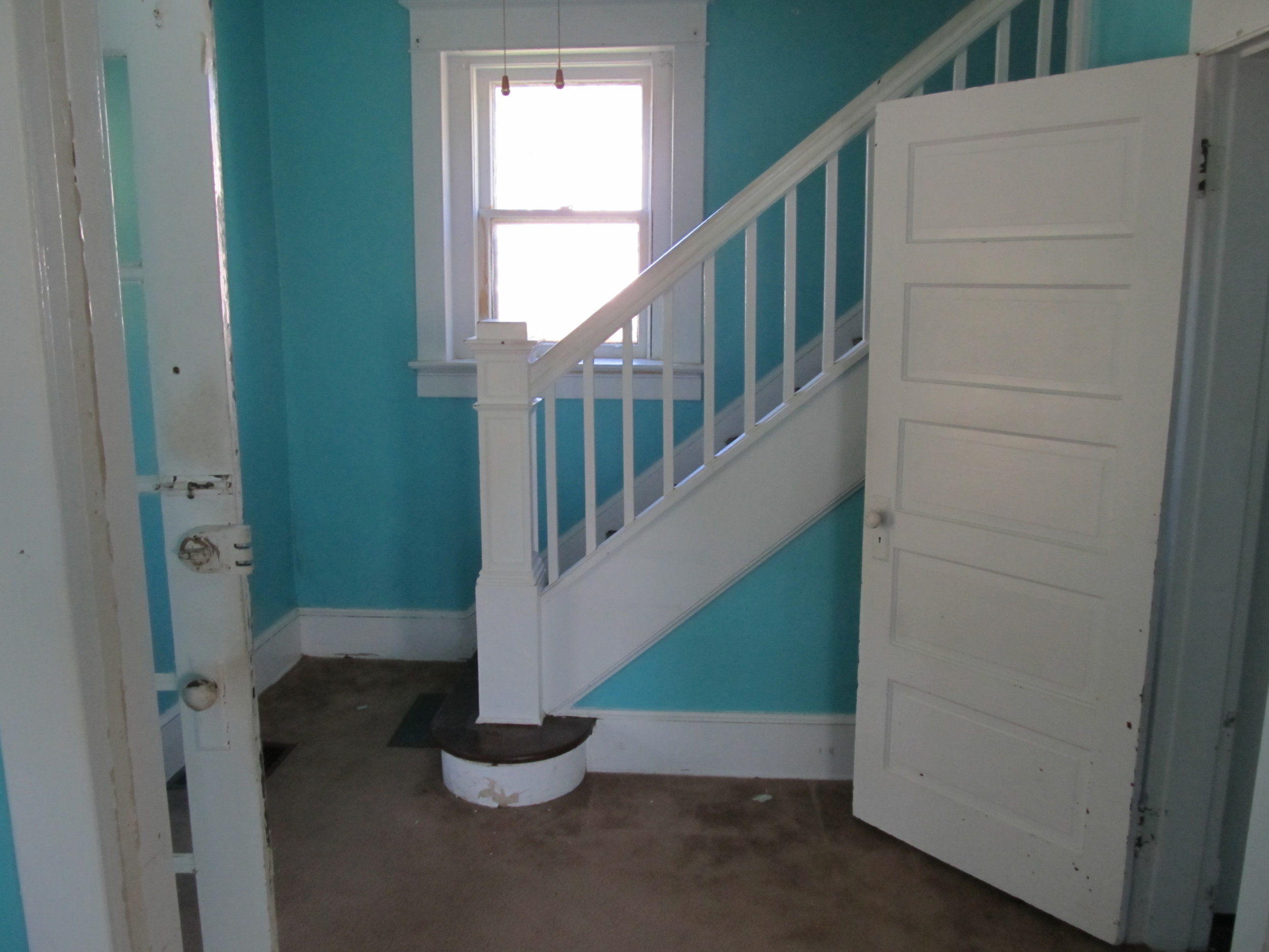 Blue Wall Yellow Door Home Stairway Before Renovation Photo