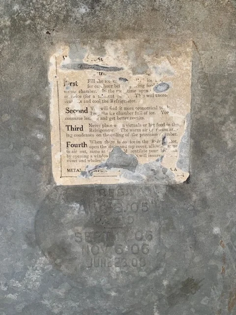 The directions label of the White Frost ice box, as seen in the farmhouse at the Anoka County Fair, says to fill the reservoir with ice one hour before placing food inside, keep the chamber full of ice for the best economy, and never place hot food in the refrigerator.