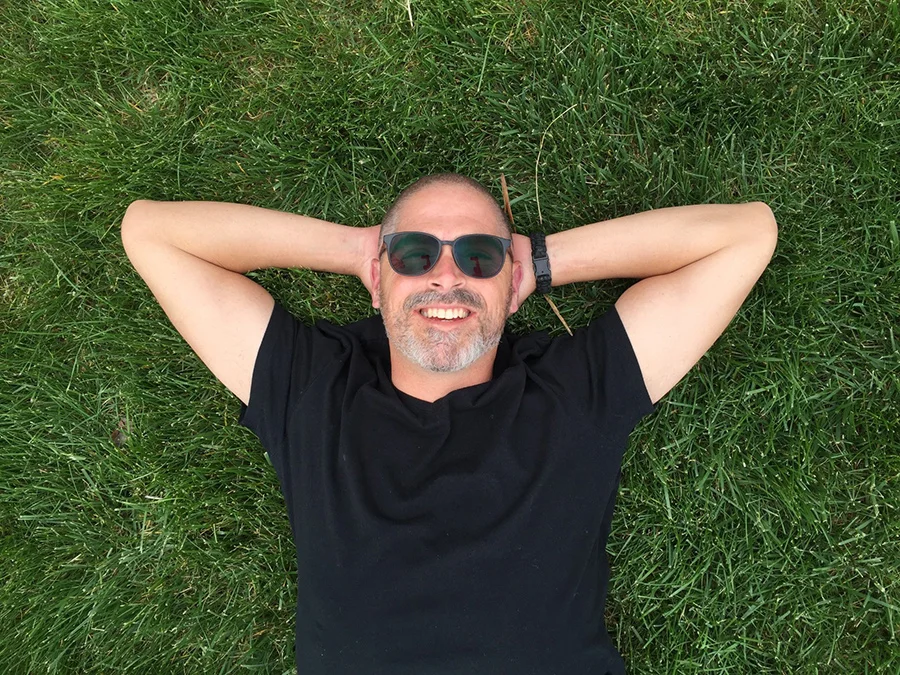 guy smiling in grass