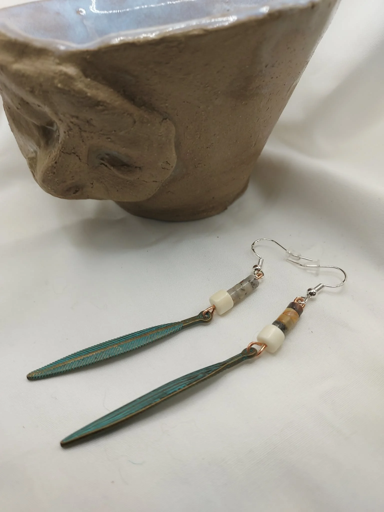 Long feather earrings with agate beads, 3" in length.