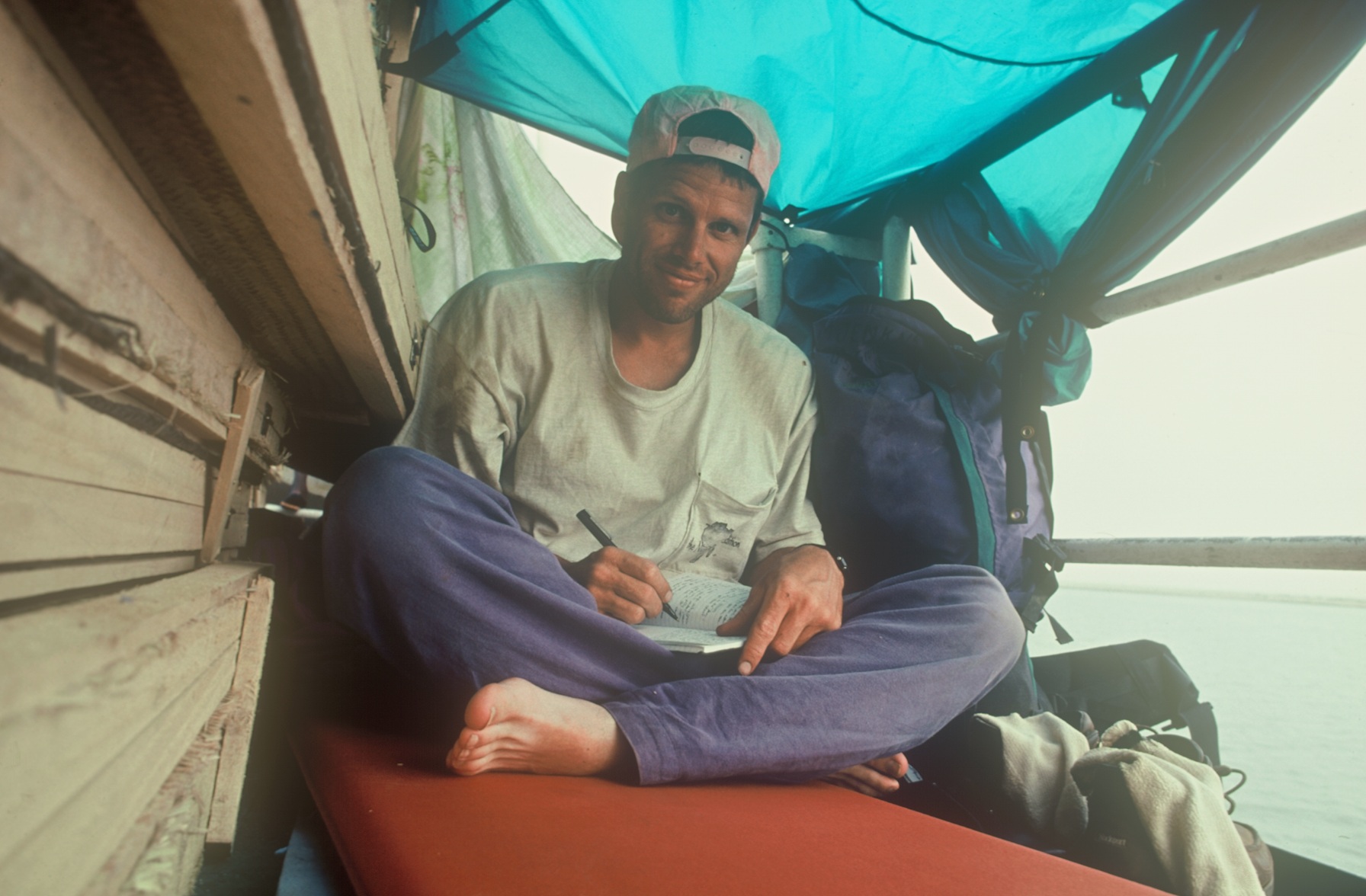  Me writing during a journey down the Niger to Timbuktu. 