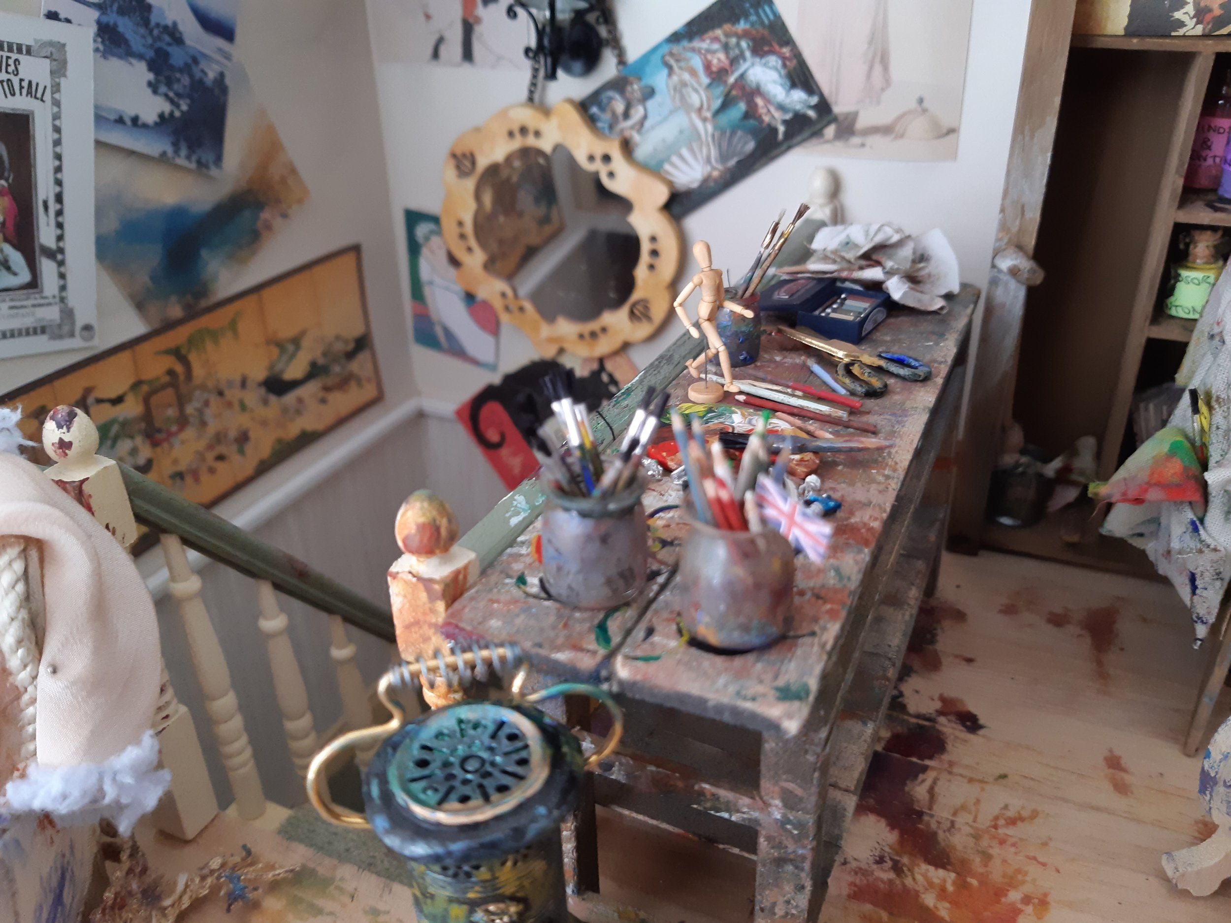  Debbie’s wonderfully messy attic studio, complete with the essential artist’s mannequin. 