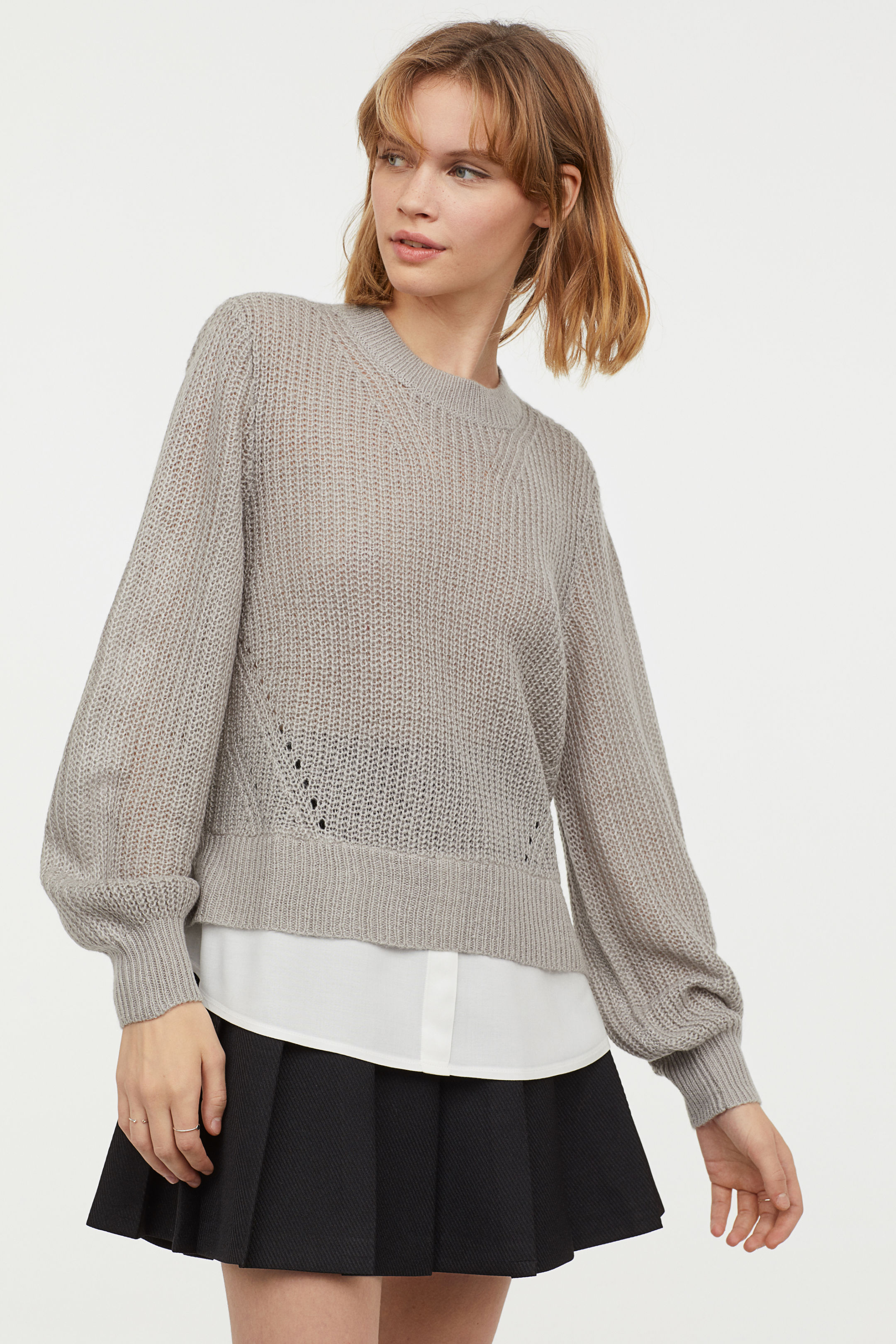  Heavy knit sweater with shaped sleeve, travelling rib details and woven shirt part 