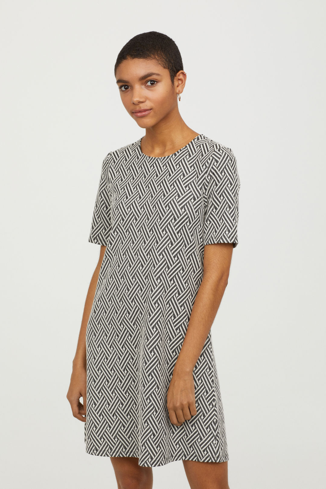  A-lined jersey jaquard dress with exposed zipper detail at back 