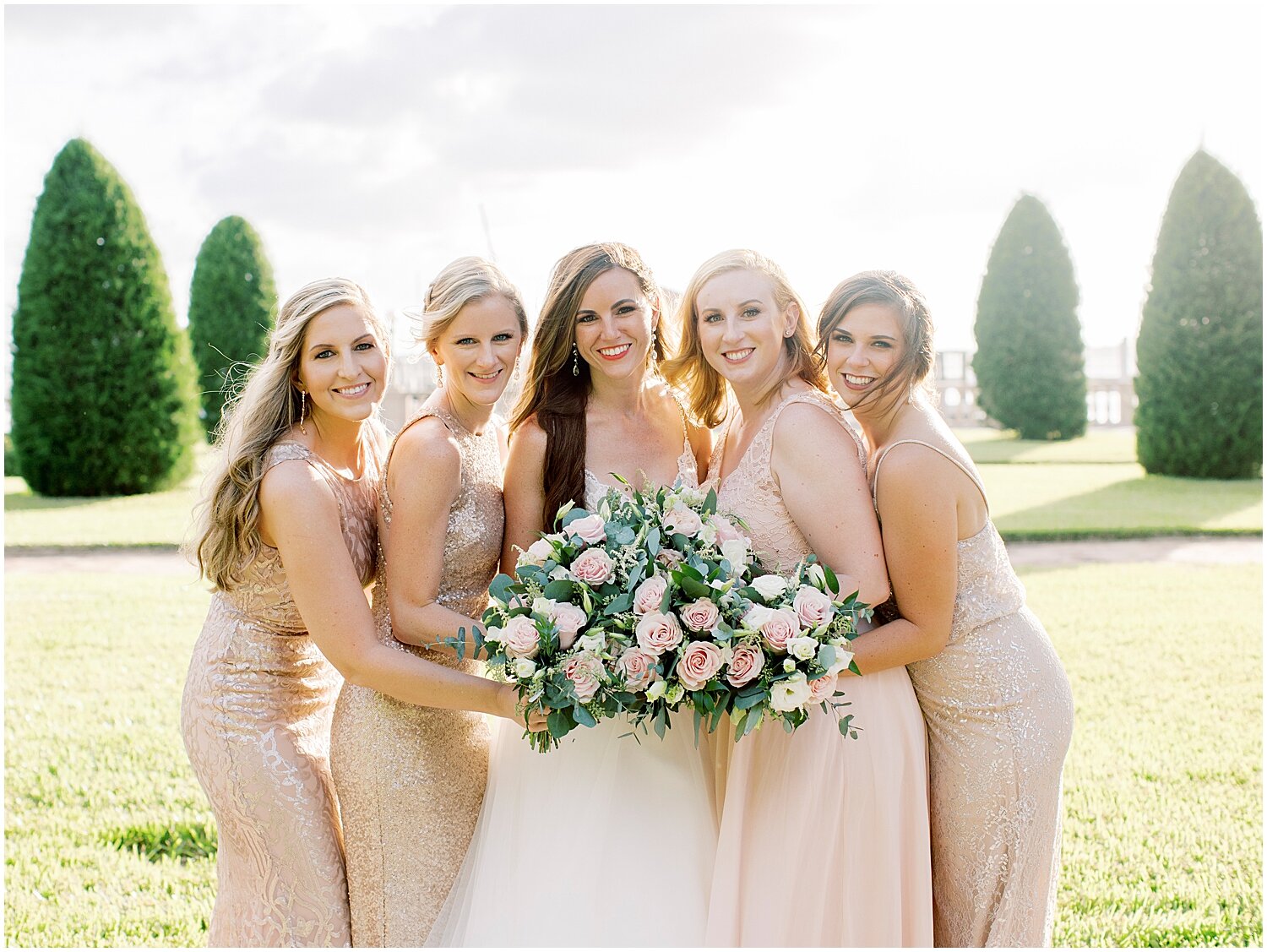  bride and bridesmaids holding their wedding bouquets 