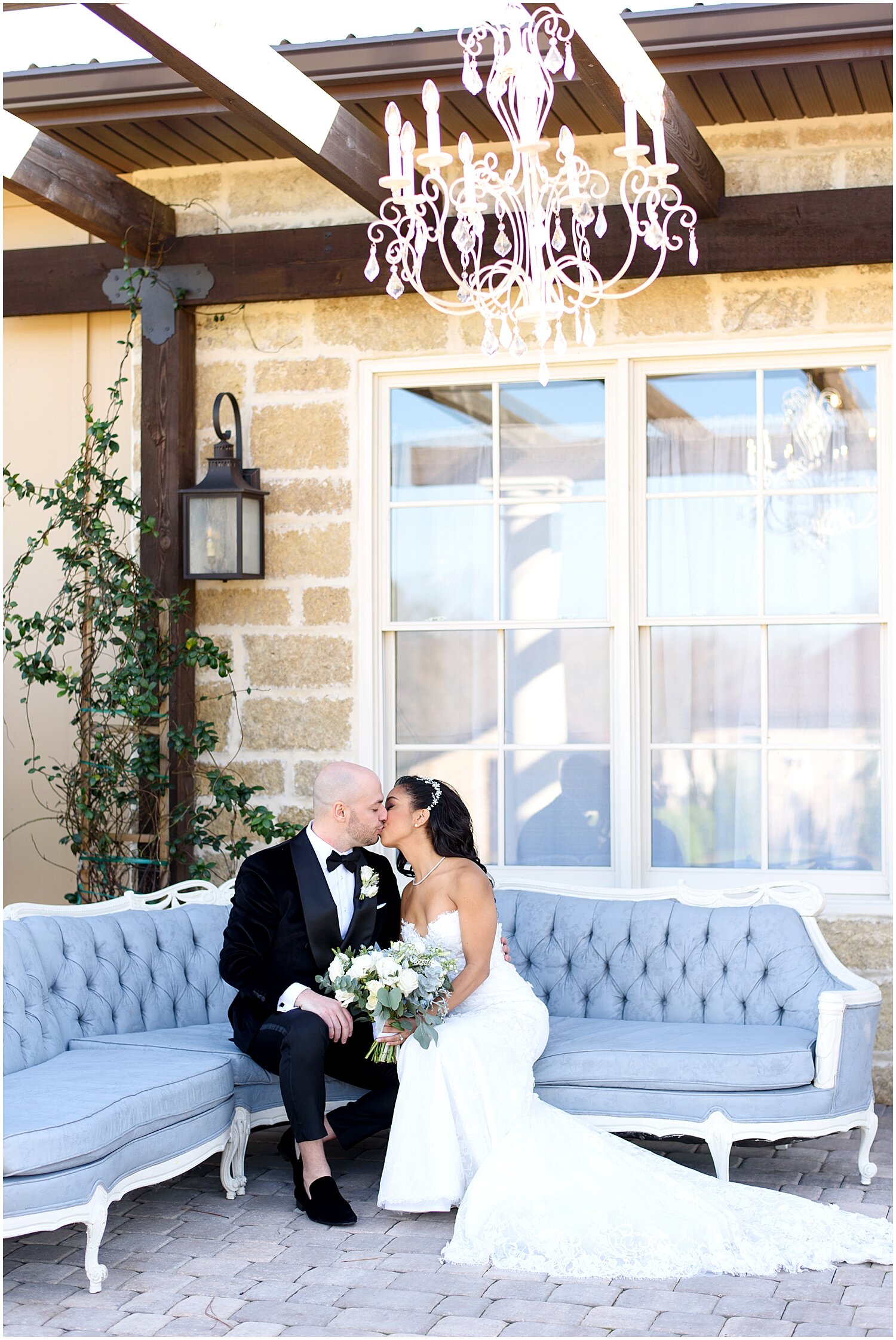  bride and groom kiss at the lounge area 