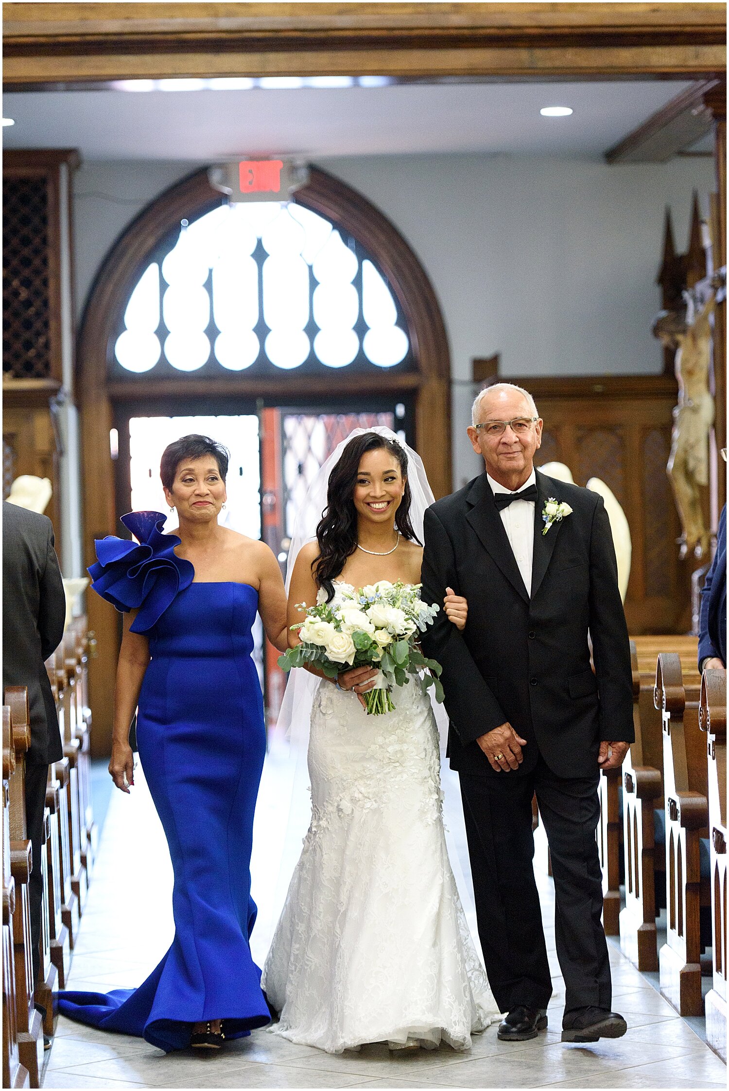  bride walking down the aisle with her parents 