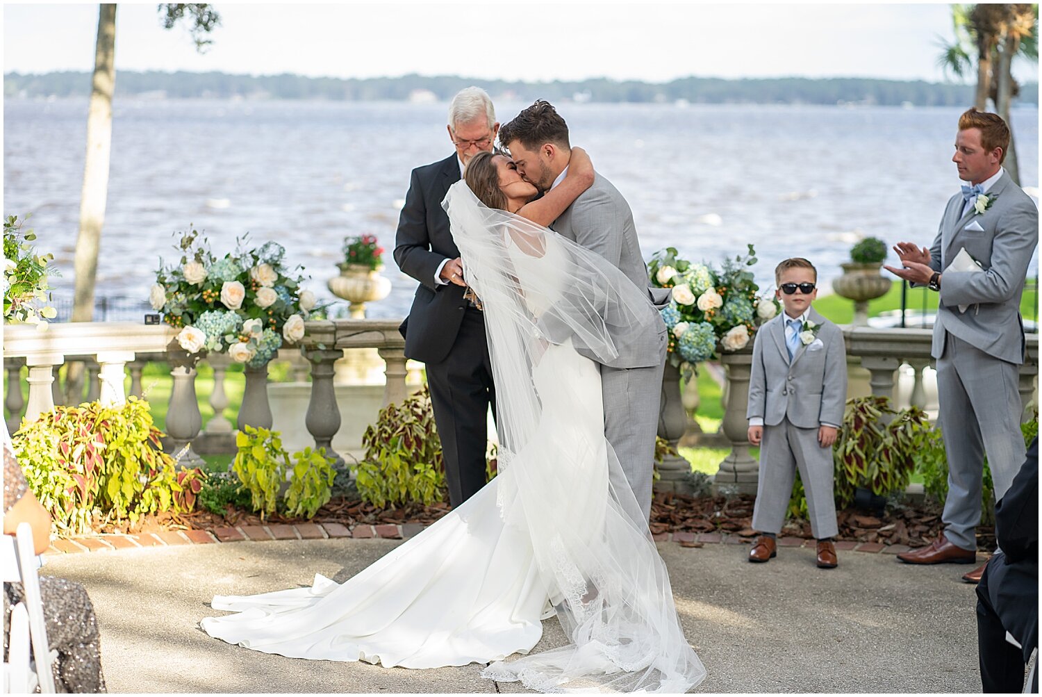  bride and groom kiss during wedding ceremony 