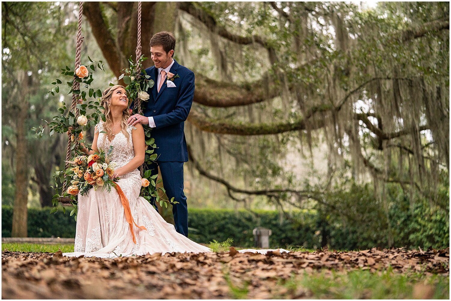  bride and groom by the Bowing Oaks swing 