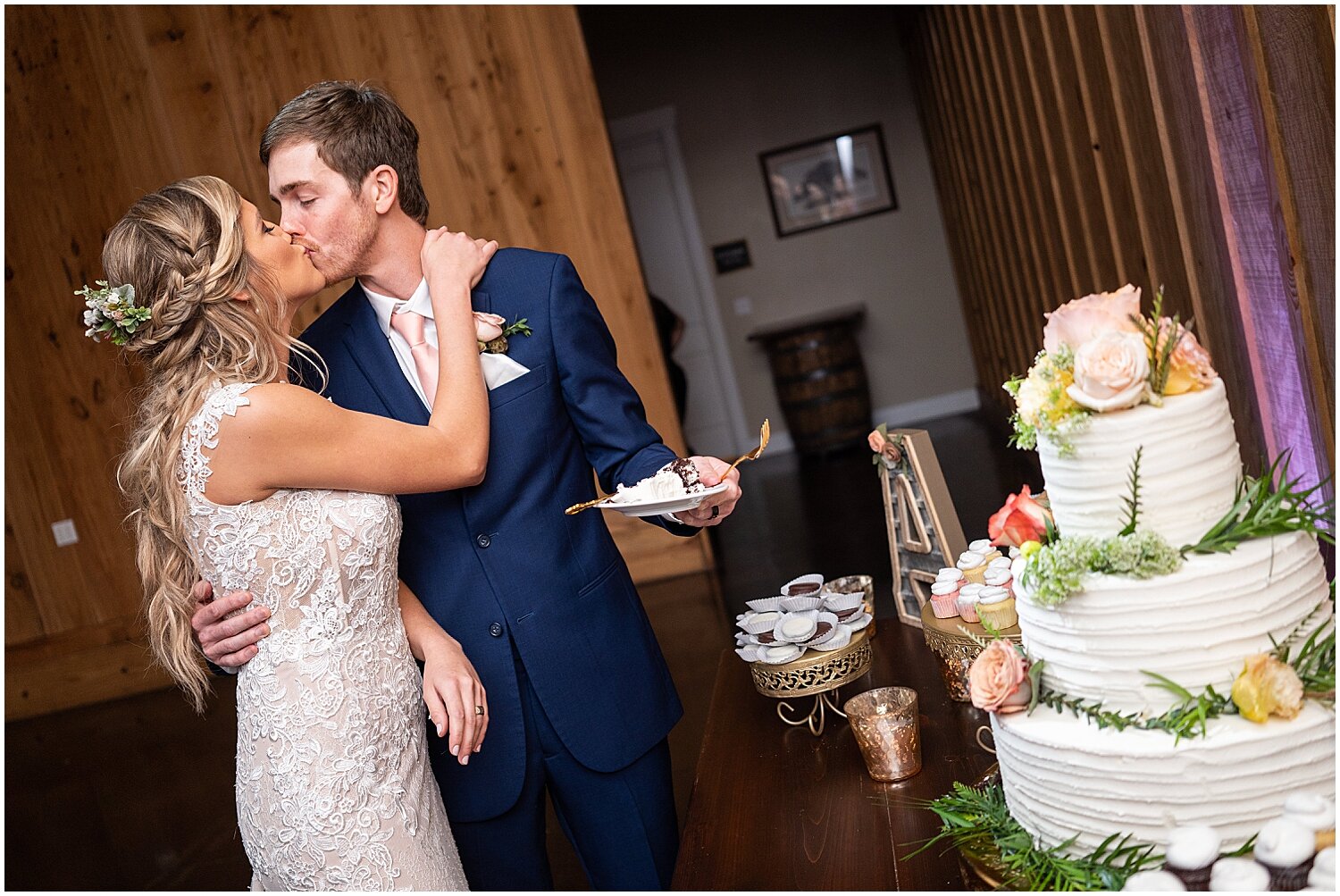  bride and groom cut their wedding cake 