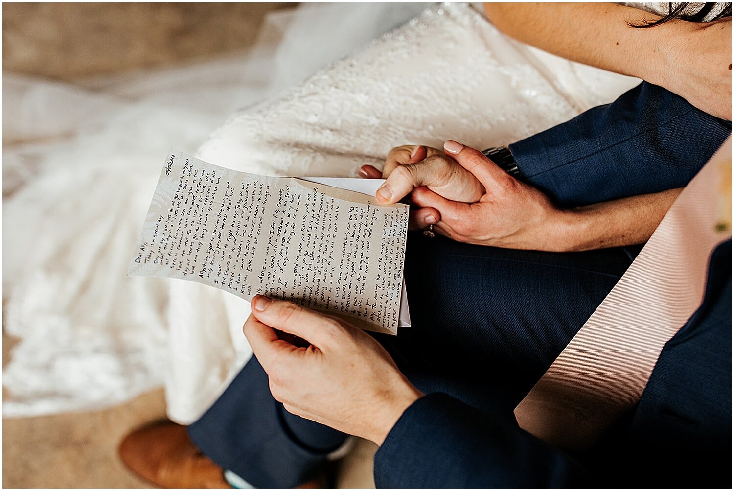  bride and groom reading letters to each other  
