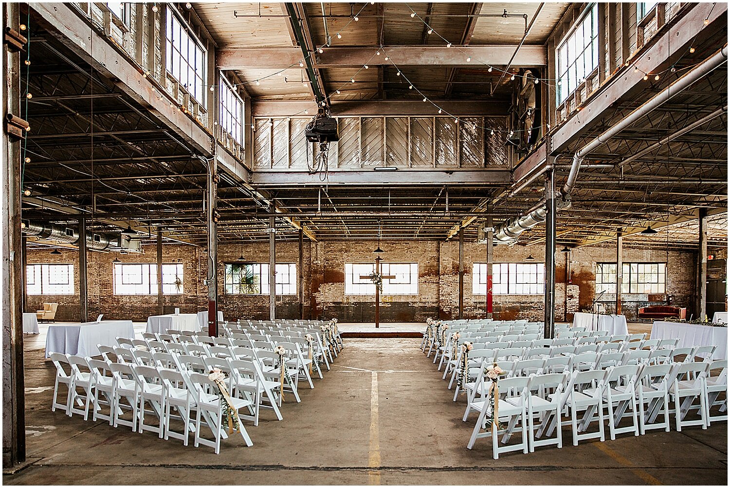  indoor industrial wedding ceremony at The Glass Factory 