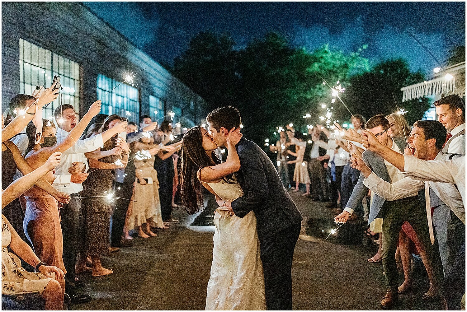  bride and groom at their grand exit with sparklers 