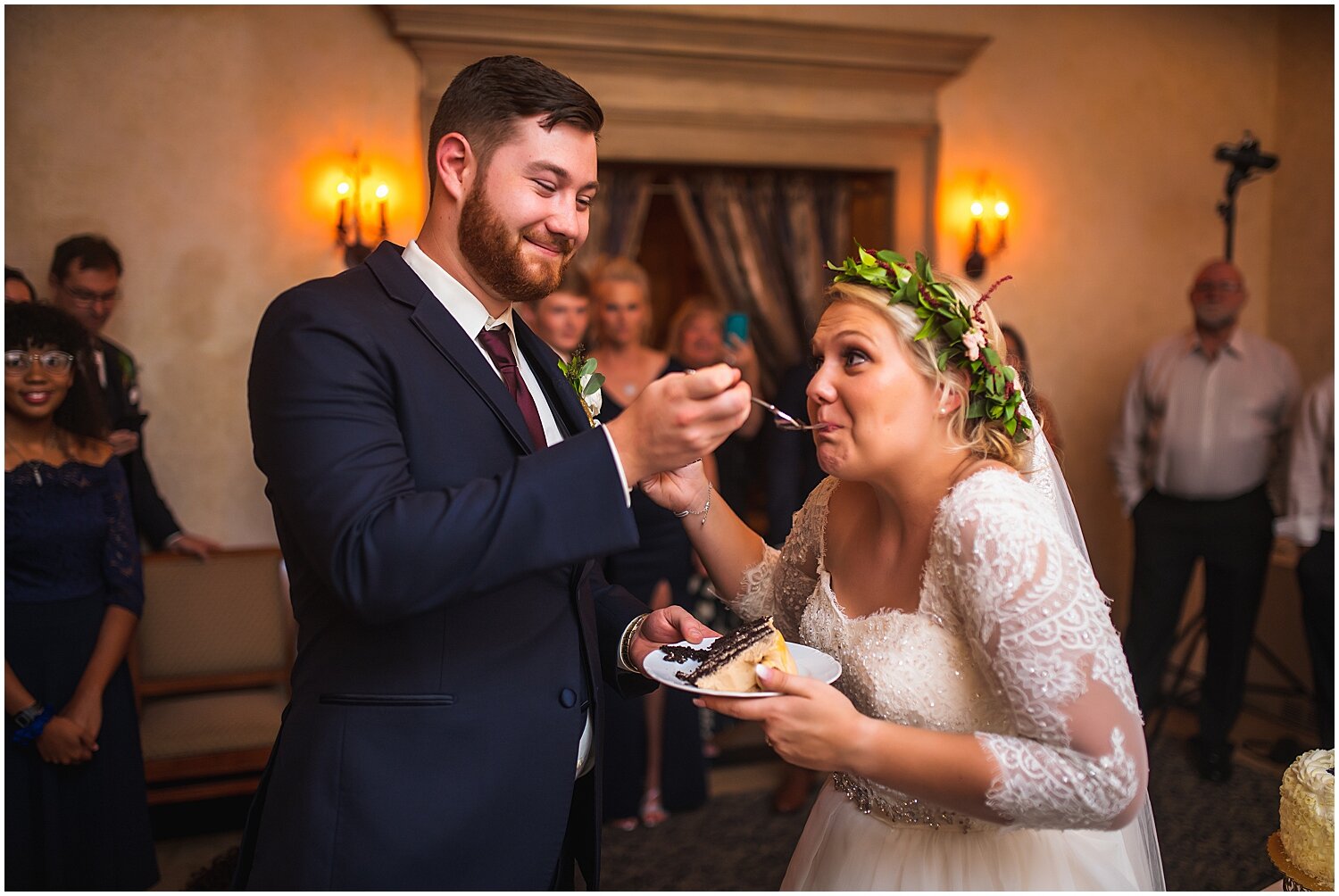  bride and groom eating their wedding cake 