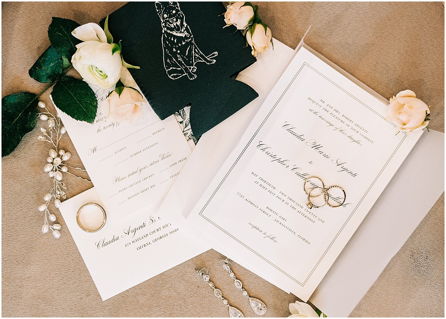  wedding invitations and wedding rings 