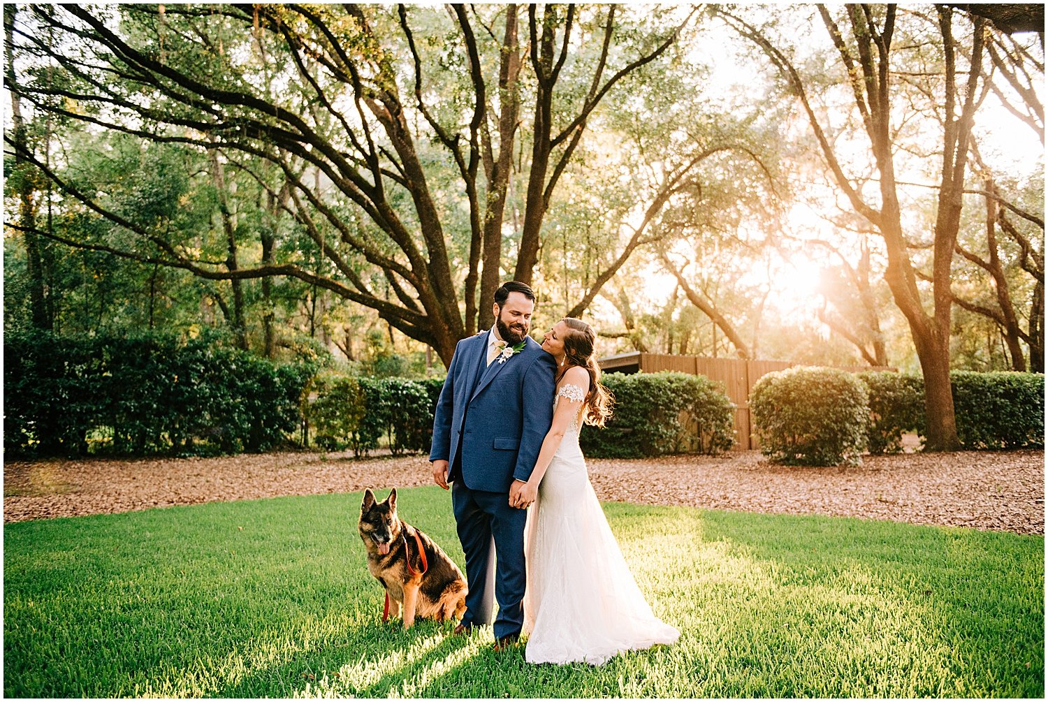  bride and groom with their dog at their Bowing Oaks wedding 