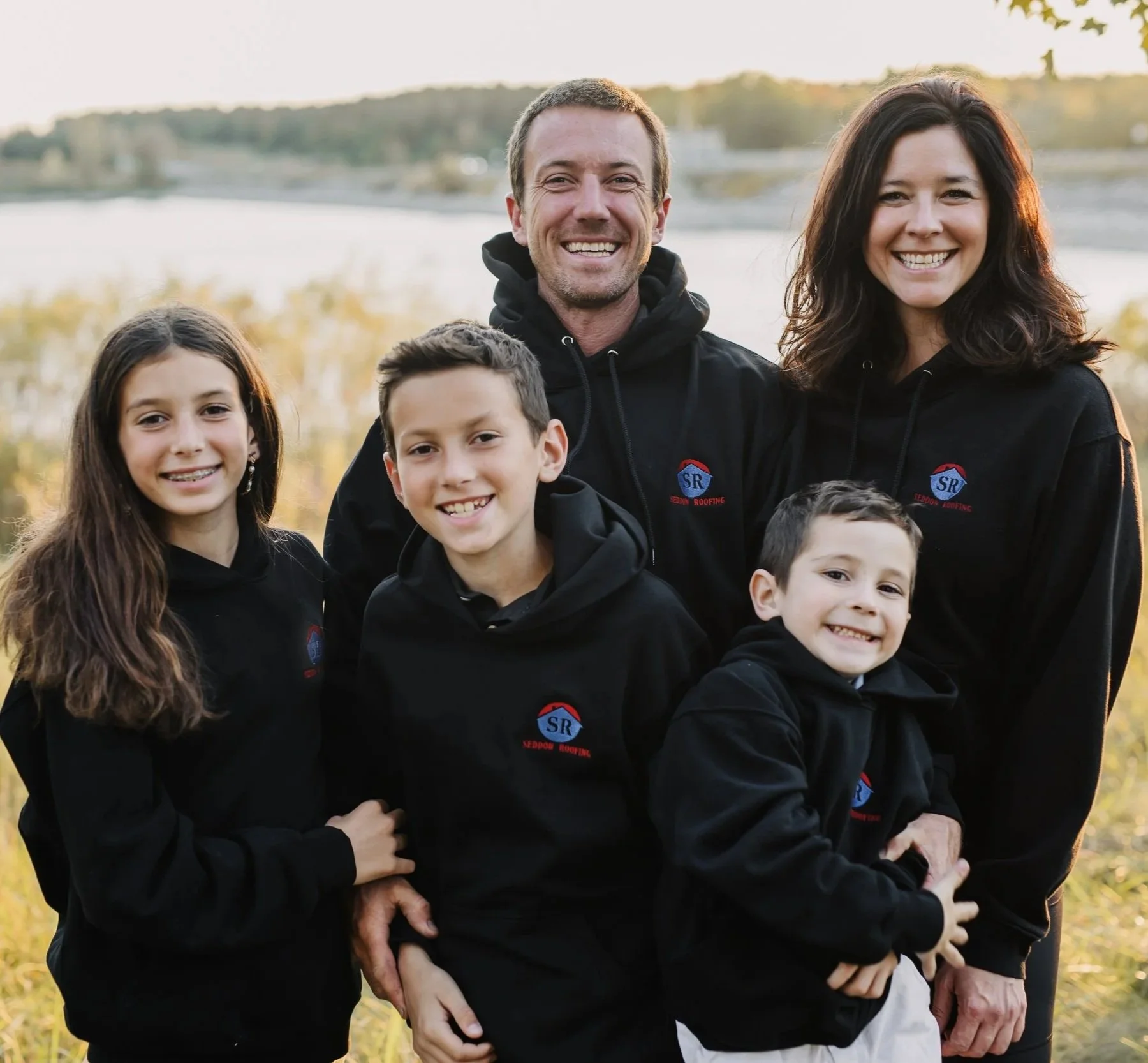 Seddon Family in Seddon Roofing sweaters