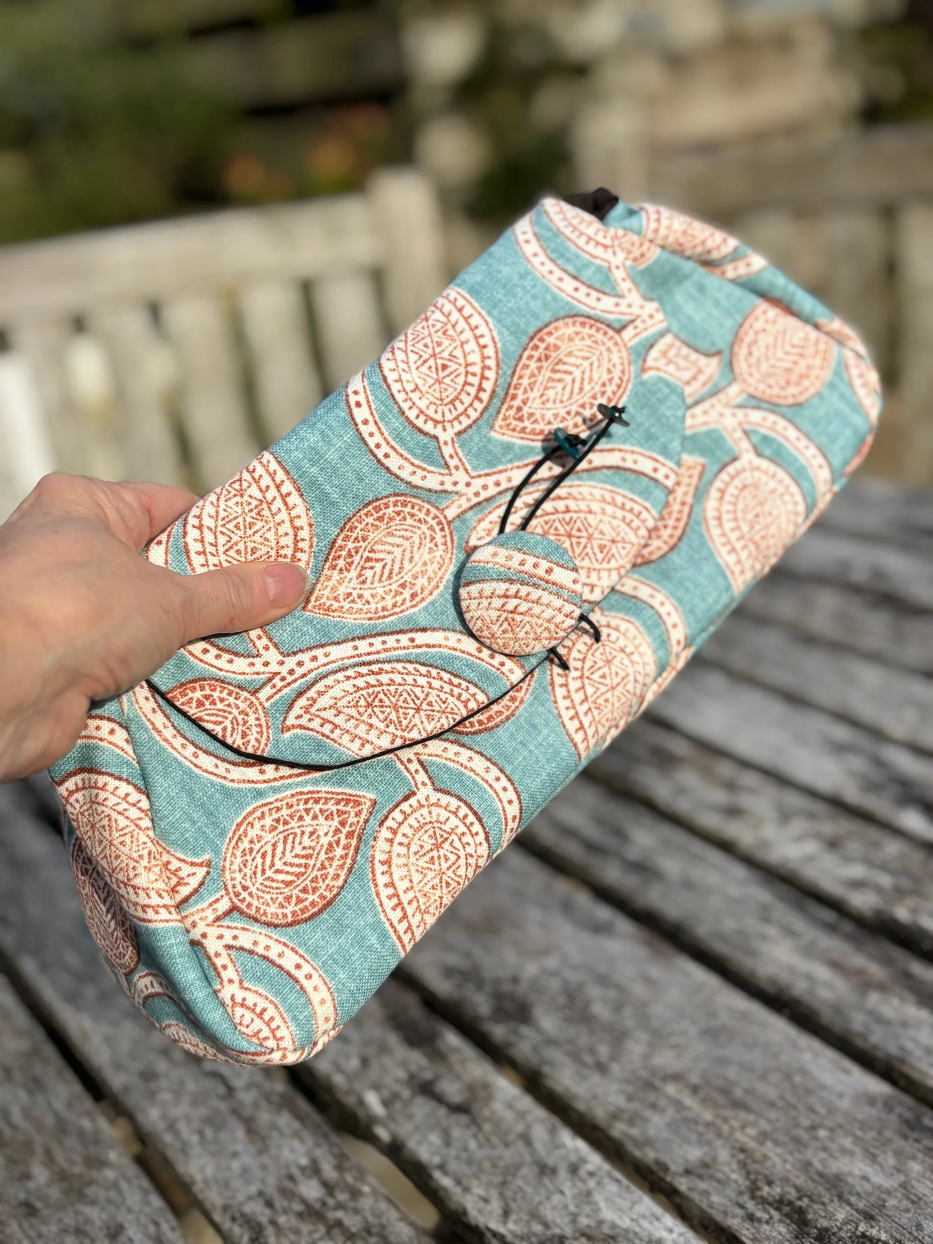 Handmade paisley floral clutch bag in sustainable cotton by Julia Cunningham UK front view