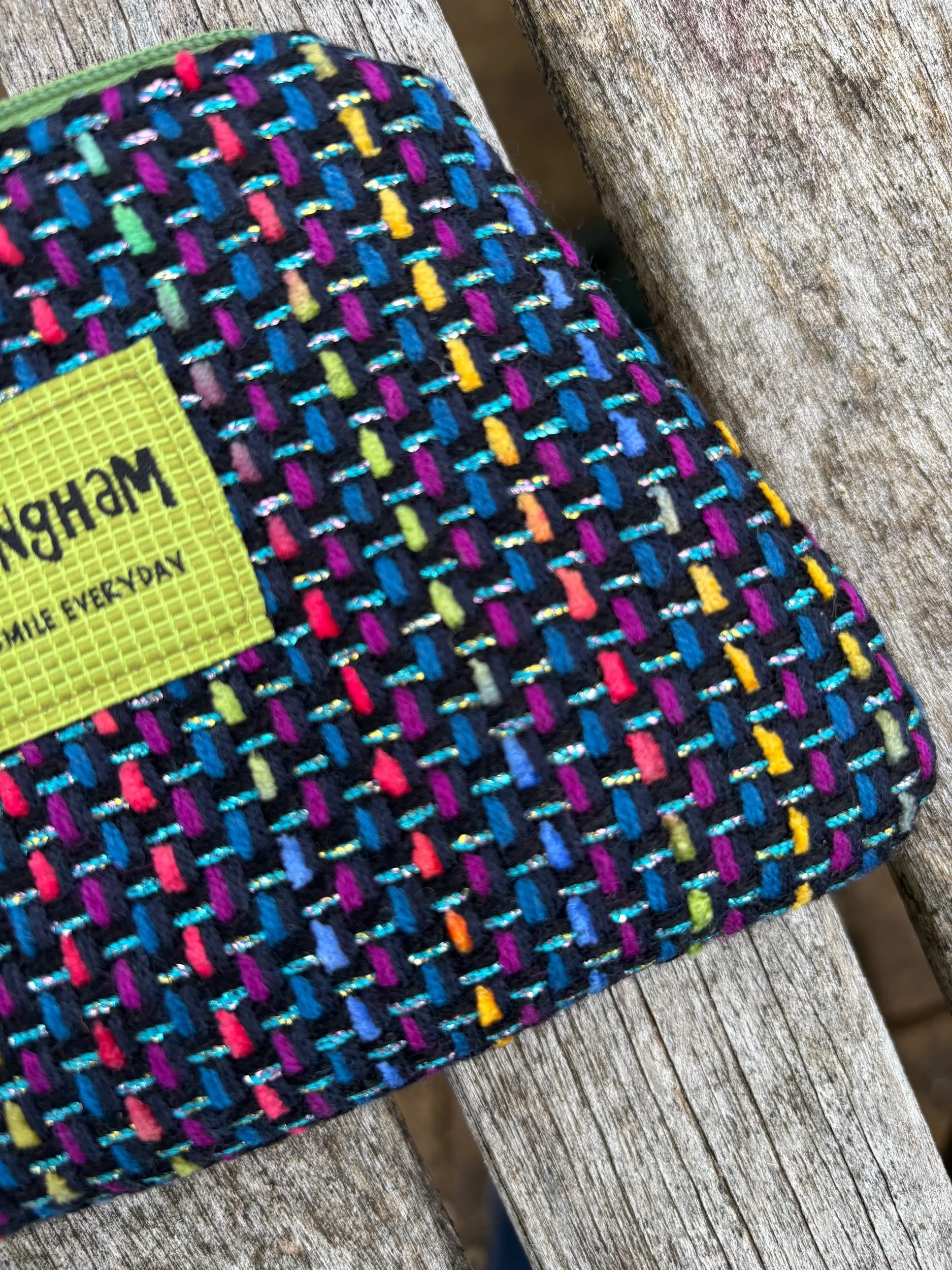 Close‑up of bright Scottish tweed fabric showing texture and weave