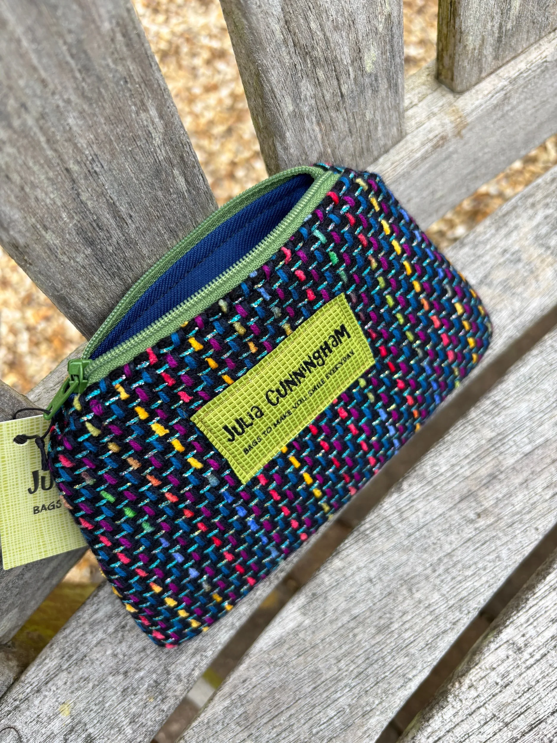 Interior of Scottish tweed coin purse with zip opened