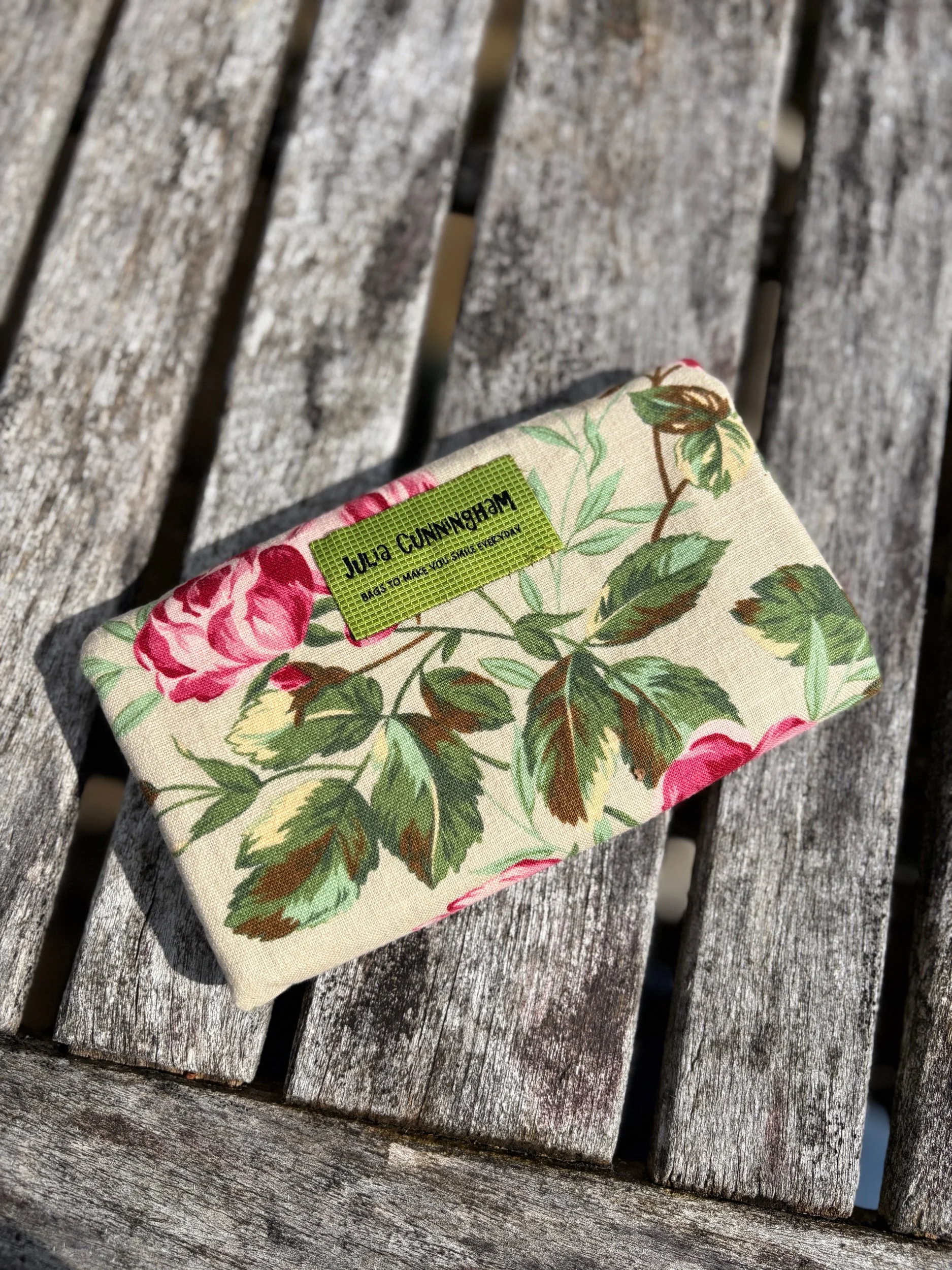 Back view of upcycled floral linen clutch bag showing full floral fabric pattern