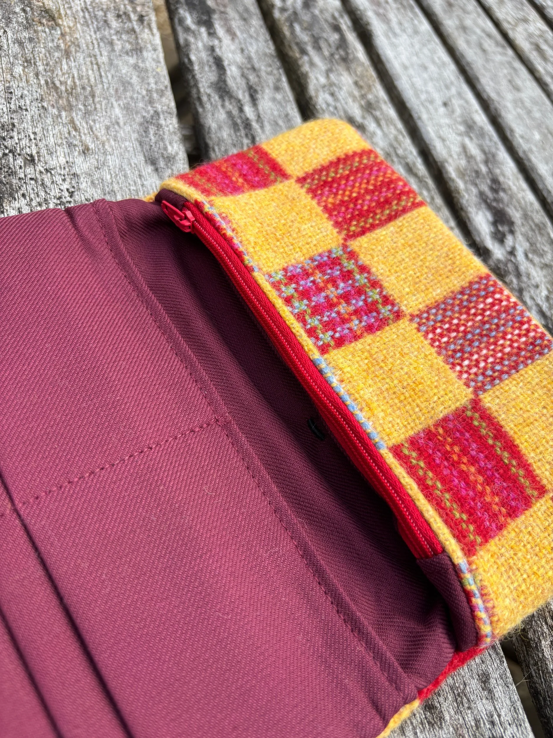 Close‑up of interior zip pocket in matching Hinnigan tweed inside handmade clutch bag by Julia Cunningham